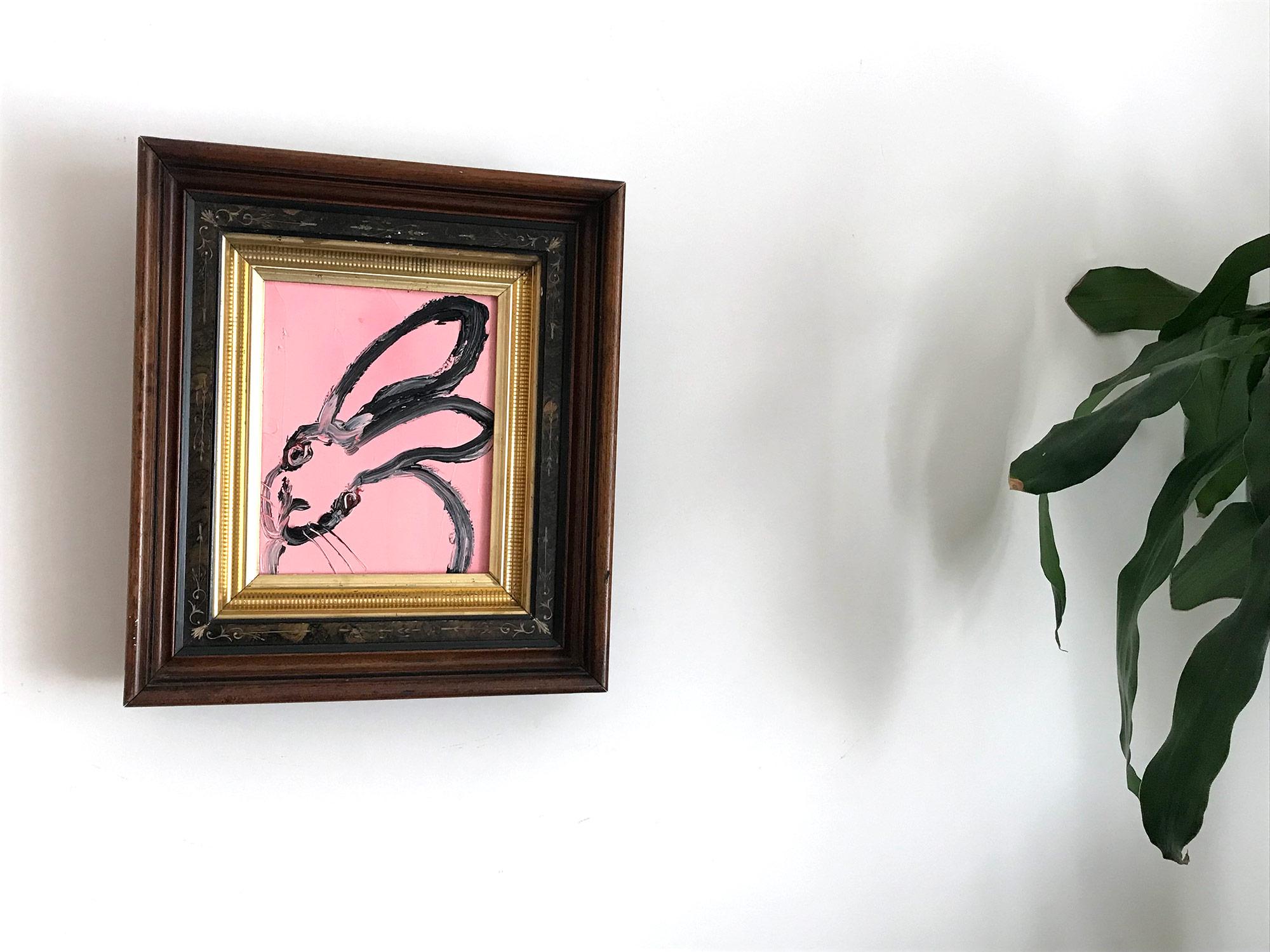 A wonderful composition of one of Slonem's most iconic subjects, Bunnies. This piece depicts a gestural figure of a black bunny on a Flamingo Pink background with thick use of paint. It is housed in a wonderful antique 19th Century frame. Inspired