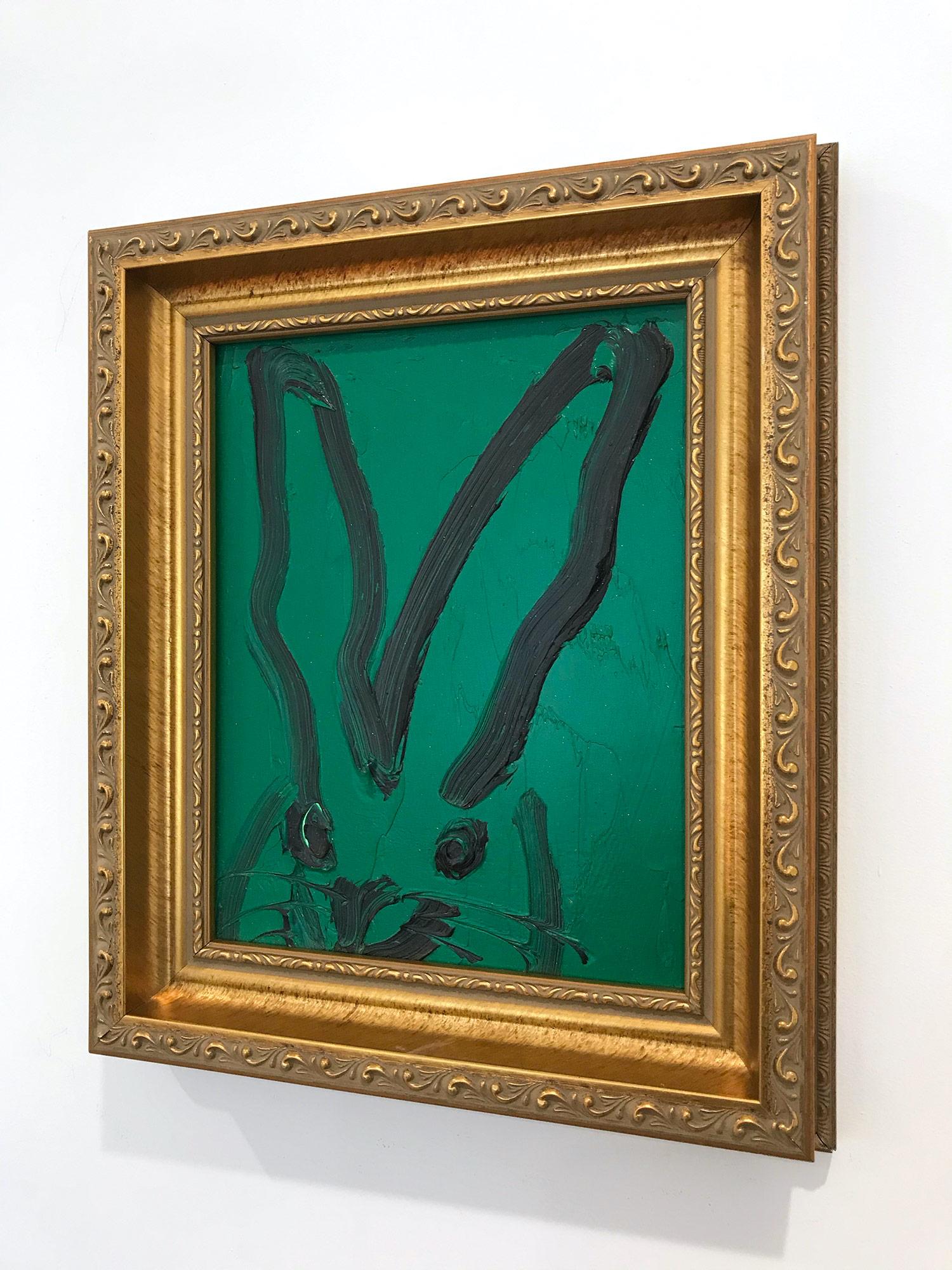 A wonderful composition of one of Slonem's most iconic subjects, Bunnies. This piece depicts a gestural figure of a black bunny on a green background with thick use of paint. Inspired by nature and a genuine love for animals, Slonem's paintings