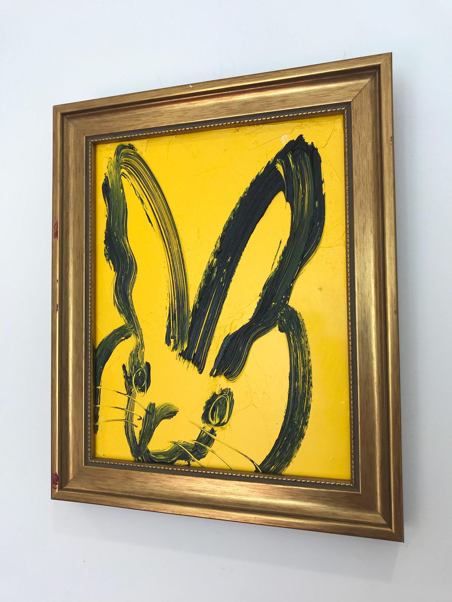 A wonderful composition of one of Slonem's most iconic subjects, Bunnies. This piece depicts a gestural figure of a black bunny on a yellow background with thick use of paint. It is housed in a wonderful antique frame. Inspired by nature and a