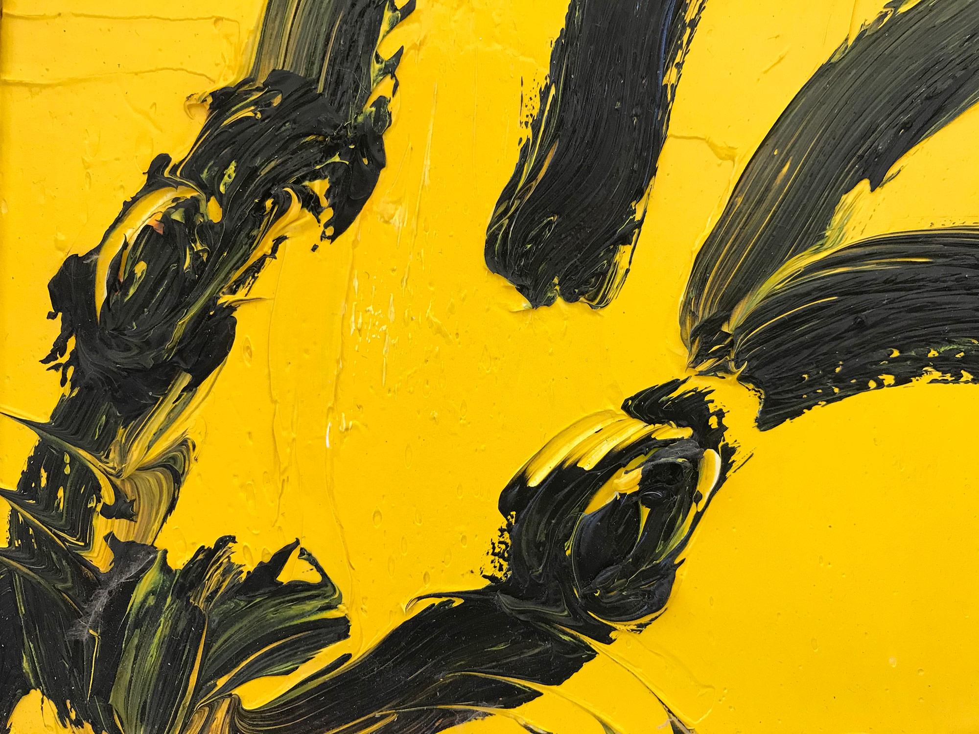 A wonderful composition of one of Slonem's most iconic subjects, Bunnies. This piece depicts a gestural figure of a black bunny on a yellow background with thick use of paint. It is housed in a wonderful antique early 20th Century frame. Inspired by