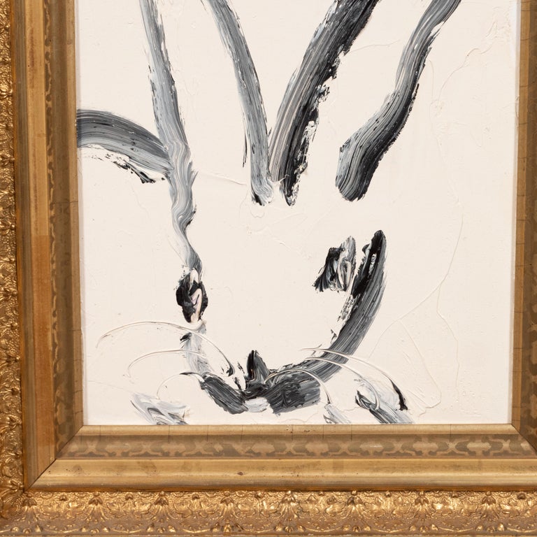 This whimsical and sophisticated painting was realized by the esteemed contemporary painter, Hunt Slonem in 2016. It presents a stylized rabbit in profile, rendered with loose and expressive brush strokes in black and white paint. Bold, graphic and