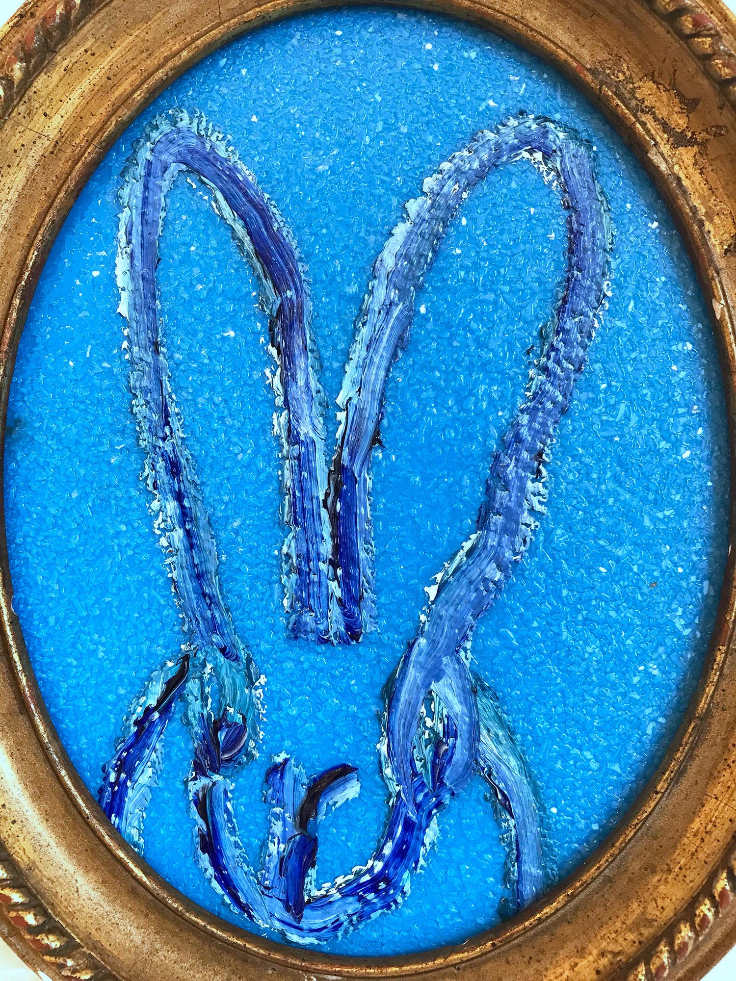 A wonderful composition of one of Slonem's most iconic subjects, Bunnies. This piece depicts a gestural figure of a blue bunny on a bright cobalt blue background with thick use of paint and diamond dust. It is housed in a wonderful antique 19th