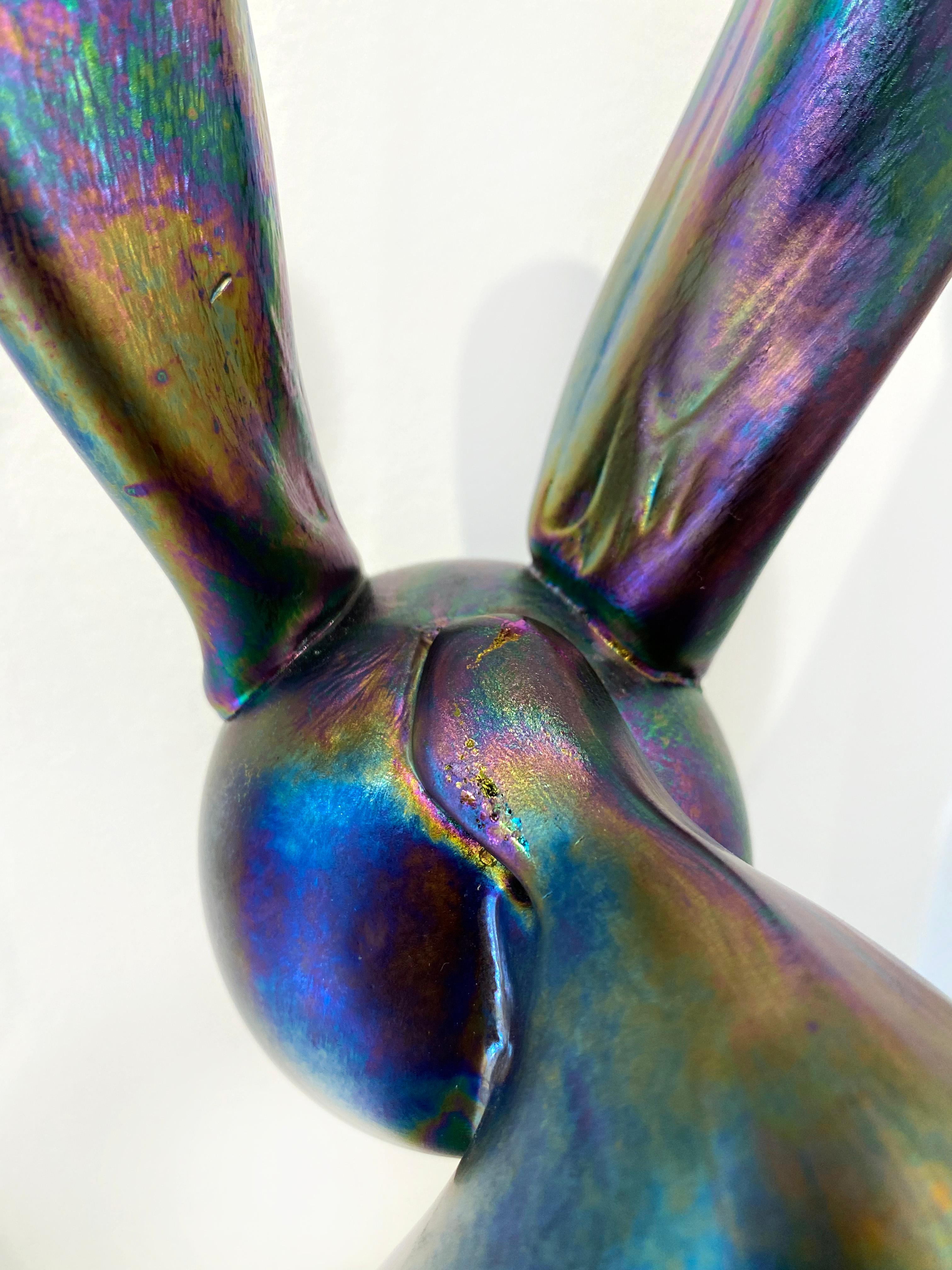 'Jessica' by Hunt Slonem, 2020. Blown-glass sculpture, 16 x 6.5 x 8 in. This glass sculpture depicts one of Slonem's signature bunnies in silver with an irridescent finish that reflects light beautifully, leaving reflected rings of yellow, purple,