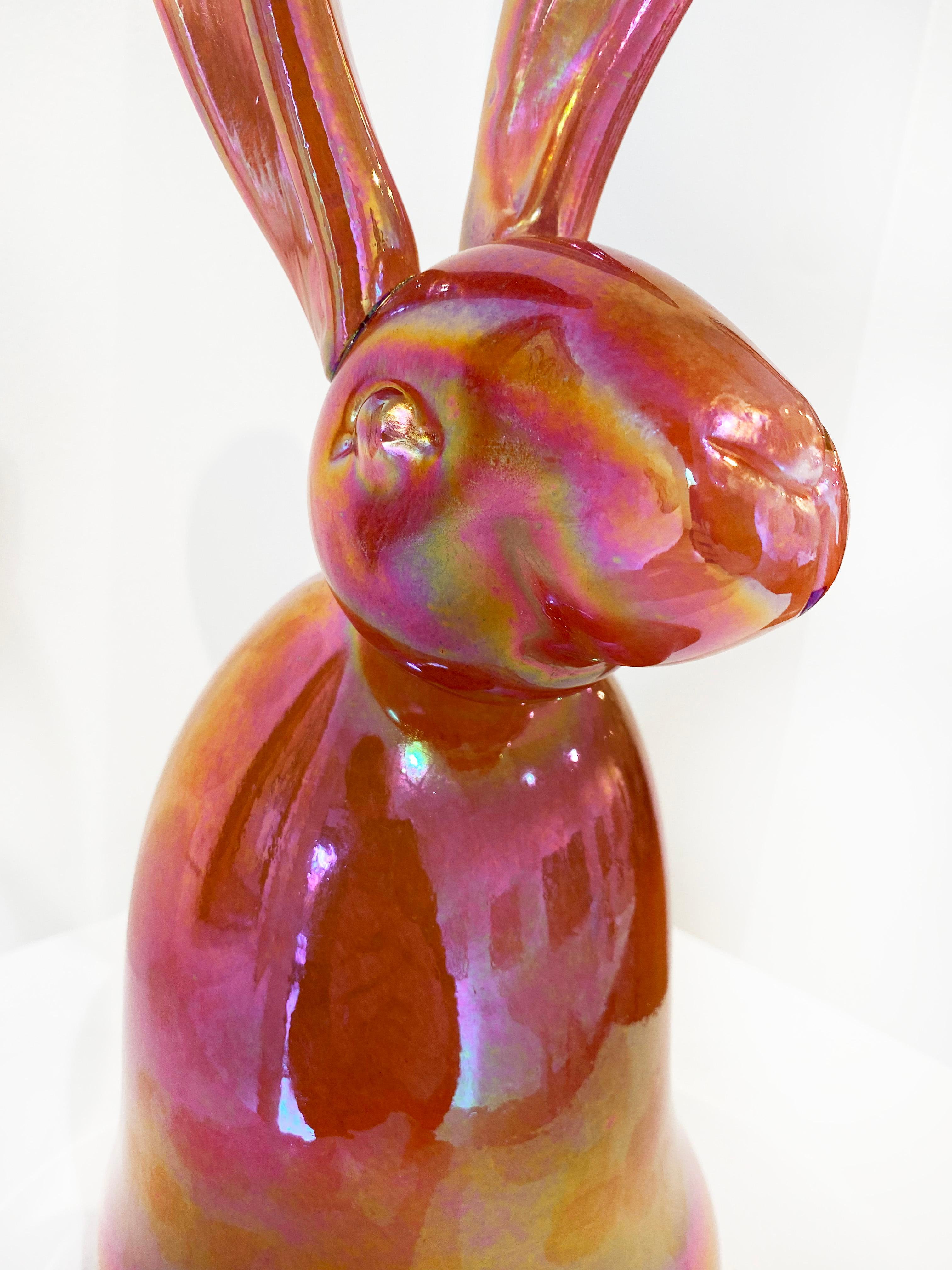 'Julius' by Hunt Slonem, 2020. Blown-glass sculpture, 17.5 x 5 x 7.5 in. This glass sculpture depicts one of Slonem's signature bunnies in bright pink with an irridescent finish that reflects light beautifully.

Slonem’s new blown-glass sculptures