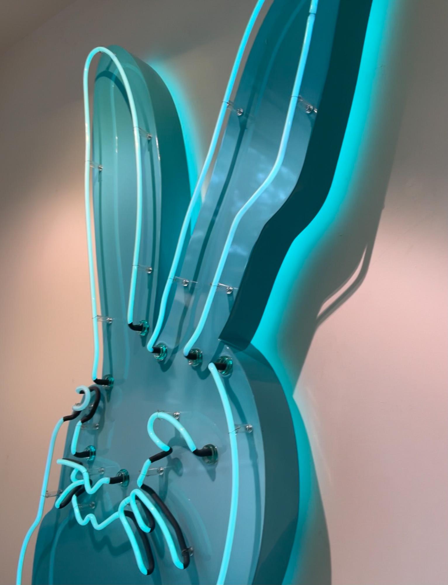 Hunt Slonem neon lighted bunny on aluminum. This piece requires especially careful handling. Professional installation is recommended. Please be aware that neon if very fragile and should be plugged in and kept on often. A nearby electrical outlet