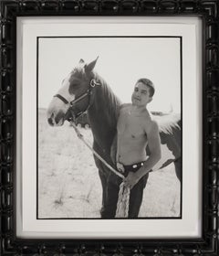 Contemporary photograph by Hunter Barnes of boy with horse at local rodeo