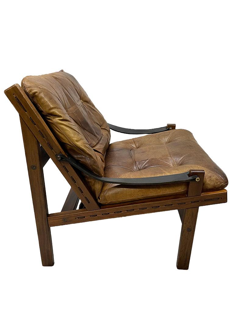 Hunter chair by Torbjørn Afdal for Bruksbo Norway, 1960s

A lounge chair designed by Torbjørn Afdal (1917-1999) for Bruksbo Tegnekontor Norway, 1960s. Model Hunter, a wooden frame with linen inside secured to the wood with threaded string. The
