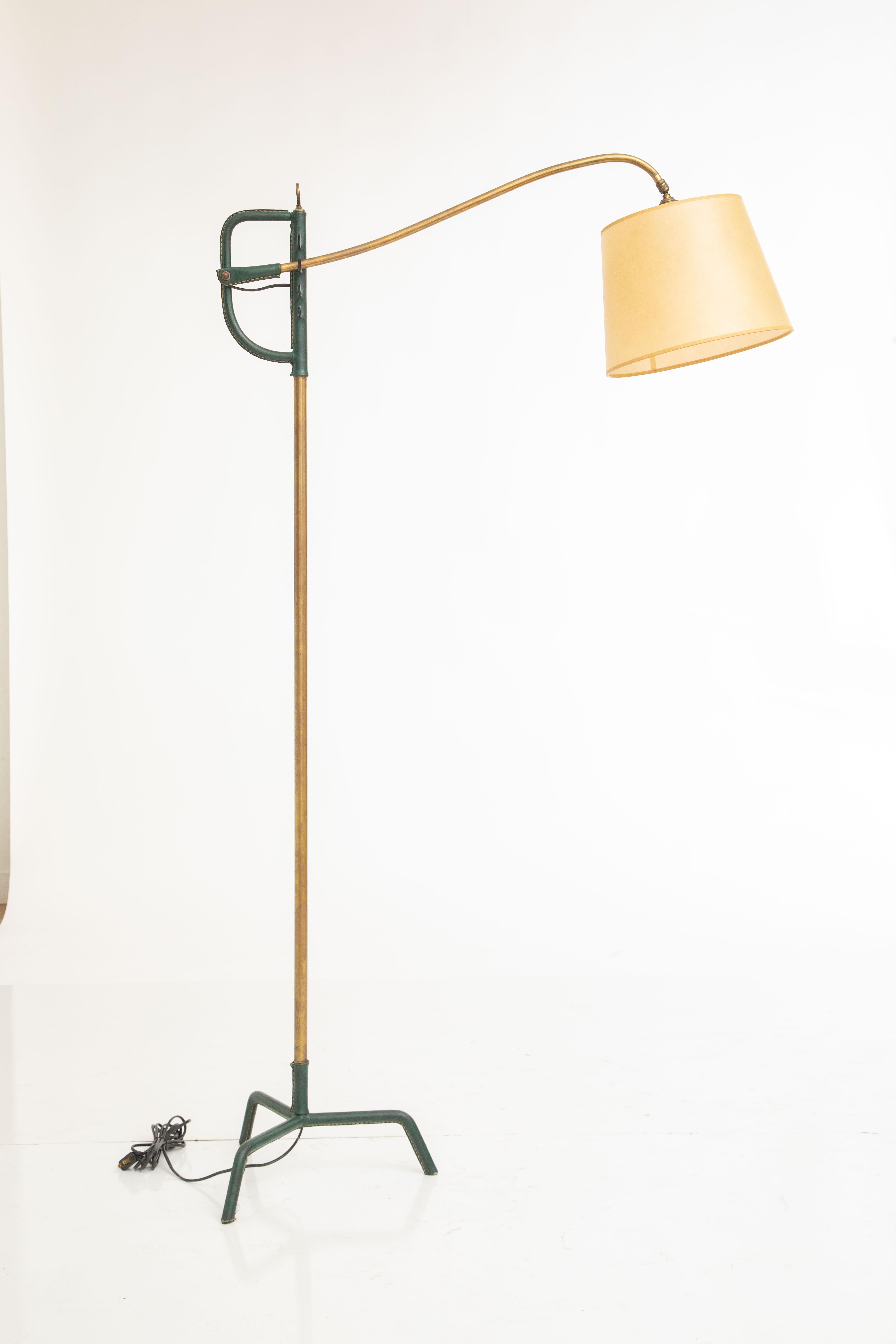 Hunter green stitched leather and brass floor lamp by Jacques Adnet
Cantilever design allows four adjustable height positions
Saddle stitched leather tripod base and top stem
Newly rewired to American standard, new silk shade.
Impeccable collector
