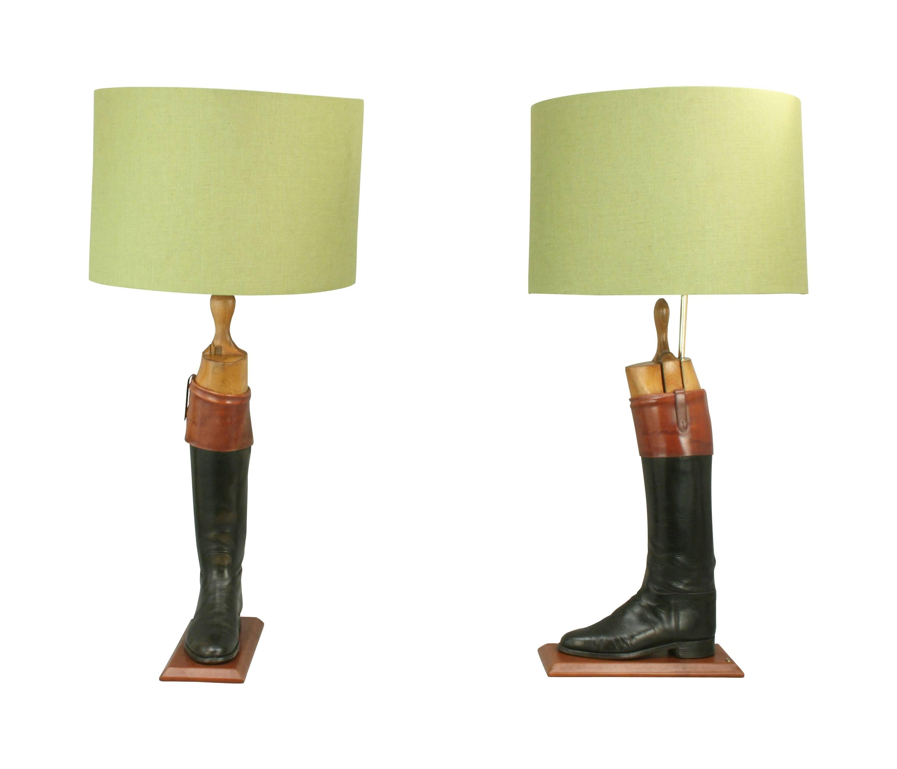 Vintage pair of black hunting or riding boot lamps.
A pair of English leather hunt or top boots with the original beech wood trees. The black hunting boots with 'Mahogany' tops (tan cuff) have been sympathetically converted into a pair of