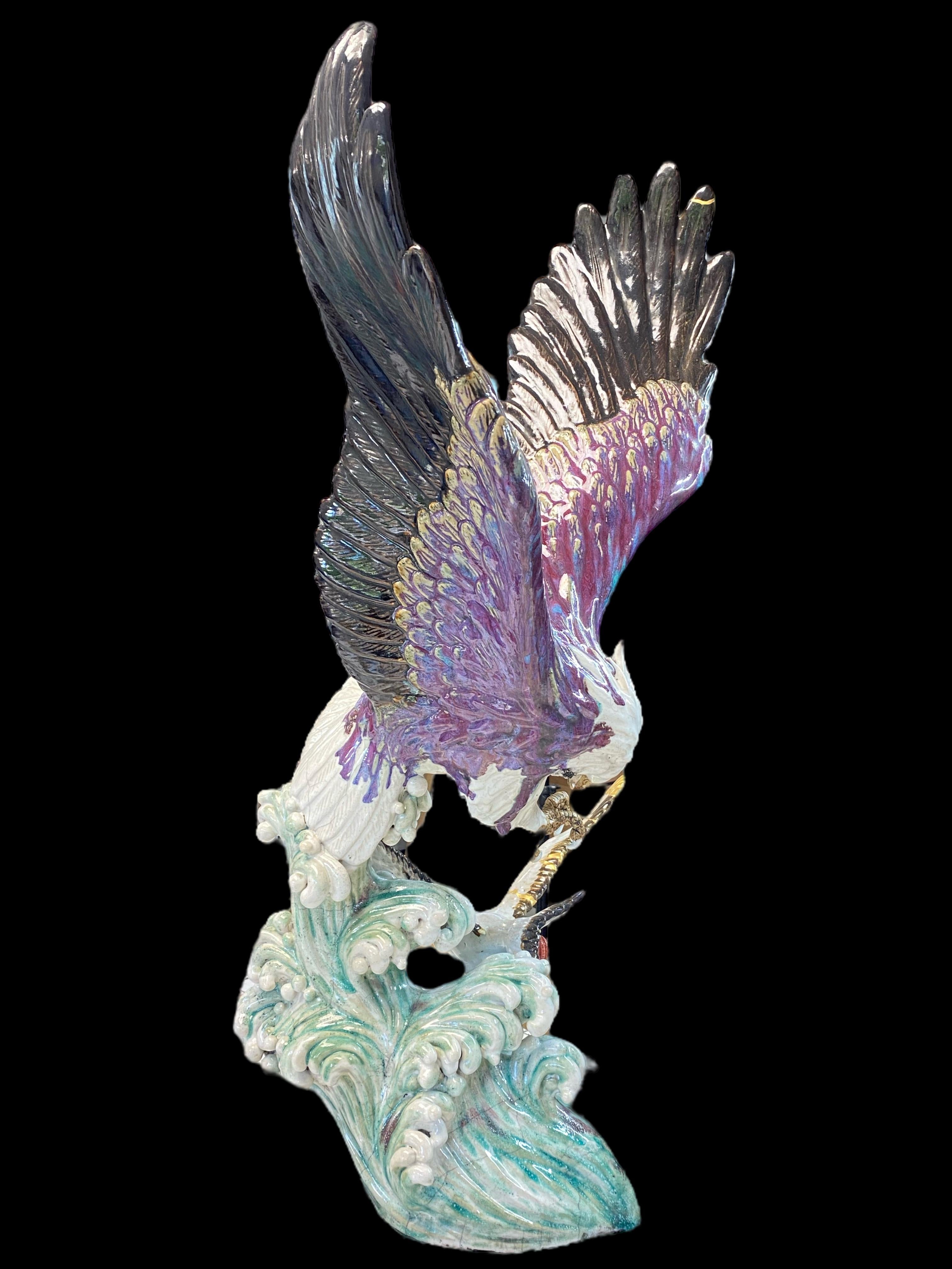 Aware : Exceptional piece !

 

This large Japanese stoneware sculpture, over 75cm high, depicts a majestic eagle with outstretched wings chasing a seagull over the waves.

In Japan, the eagle symbolizes intelligence and power, and this is exactly