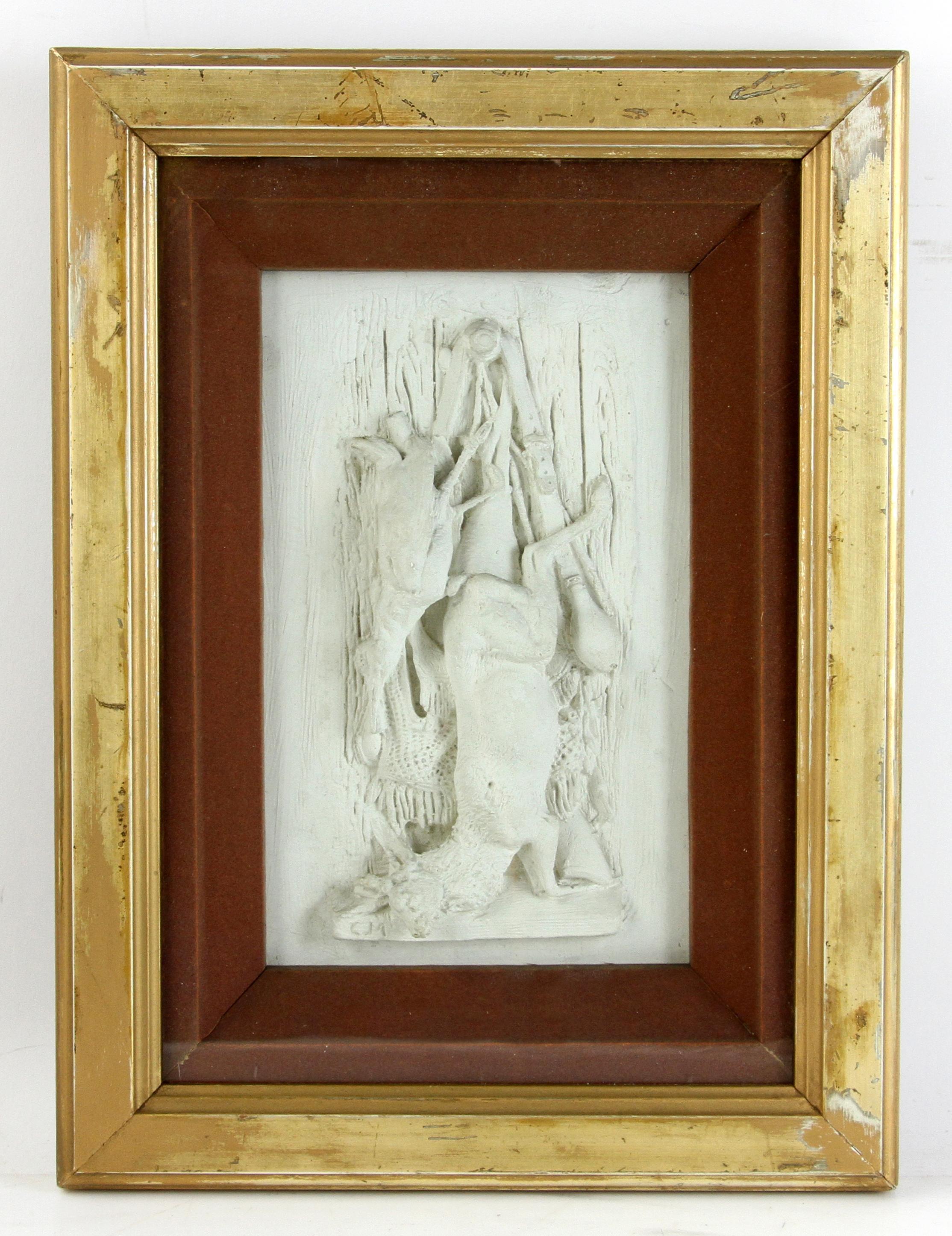 Animal Hunting motif-set of three gilt-framed plaster reliefs depicting wild boar, deer, and hare still life’s in white paster relief in burnt sienna velvet shadow boxes with original glass and gilt frames. All are signed CM by the artist.