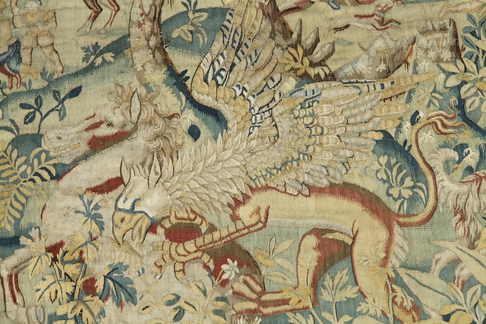 Important tapestry representing a hunting scene in the woods near a palace. Exotic and fantasy animals such as a unicorn, a griffin and a leopard are at the forefront, and the hunters and the pack at the back of the composition. An architectural