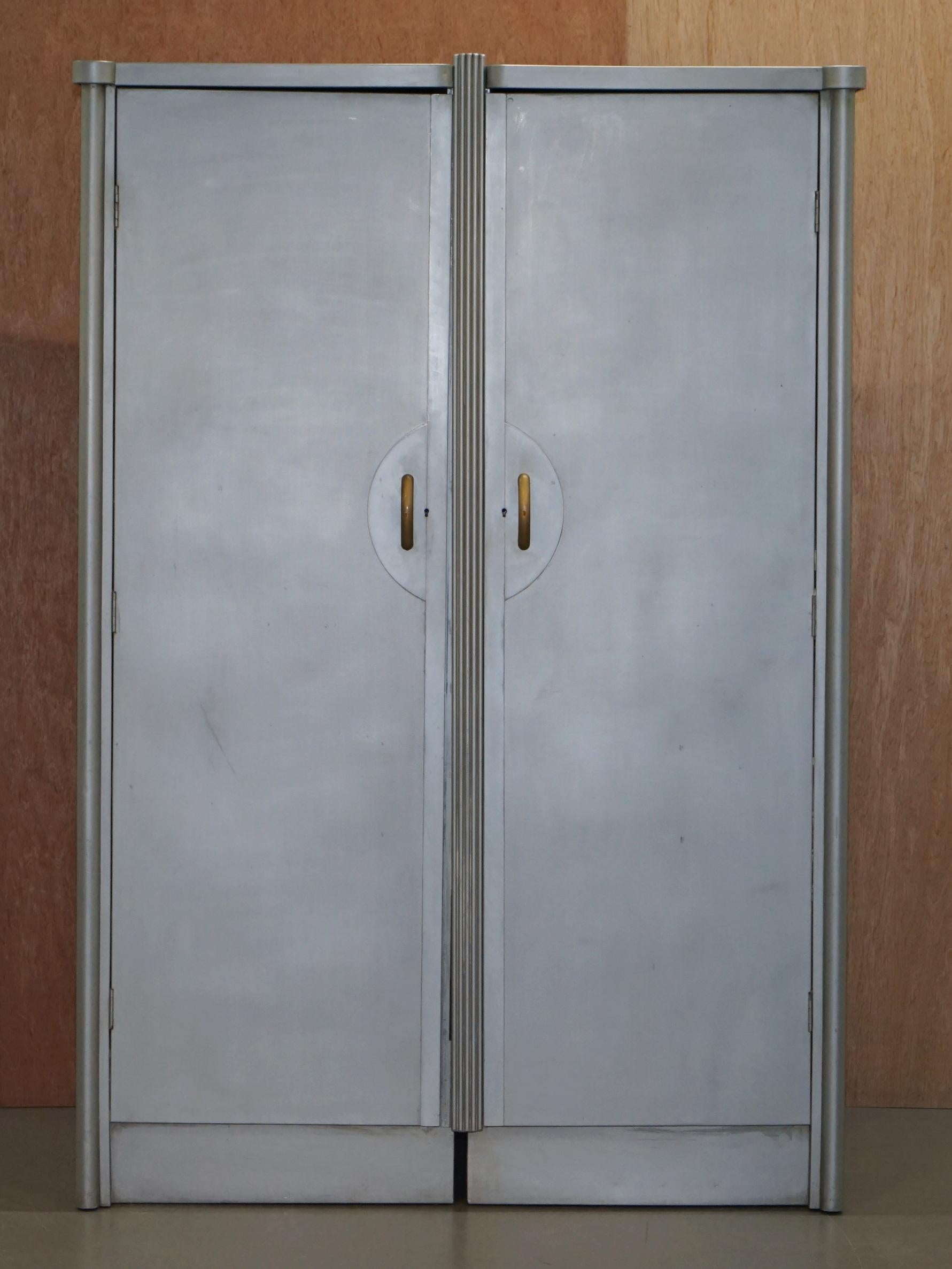 We are delighted to offer for sale this stunning original Huntington Aviation Art Deco aluminium wardrobe

This piece is part of a suite, I have in total a bedside table, a tall boy cupboard, the head and foot bed boards, a large double wardrobe