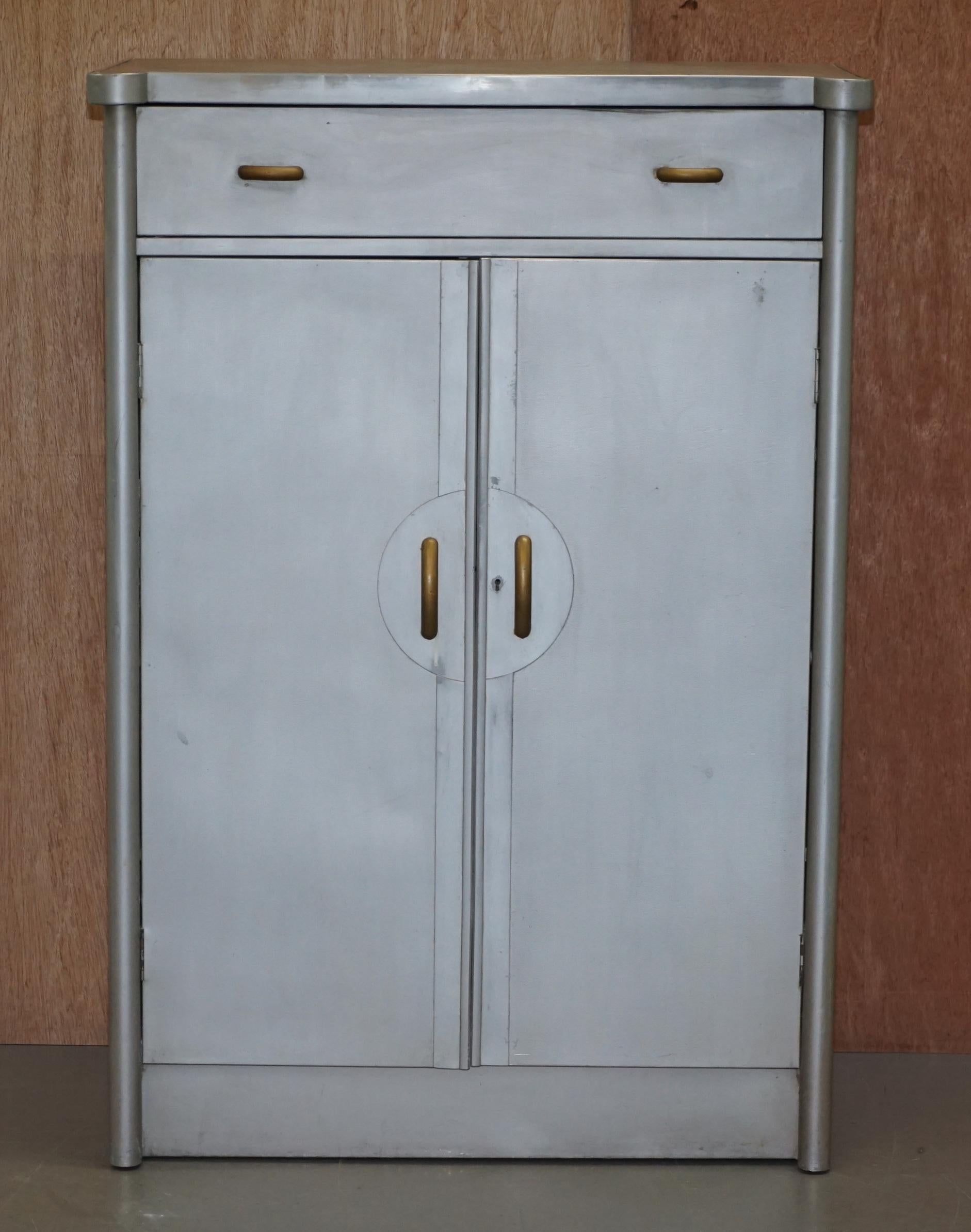 We are delighted to offer for sale this stunning original Huntington Aviation Art Deco aluminium tall boy cupboard

This piece is stamped to the rear as follows “DESIGNED AND PATENTED BY P.B. COW AND COMPANY LIMITED MADE BY HUNTINGTON AVIAVATION