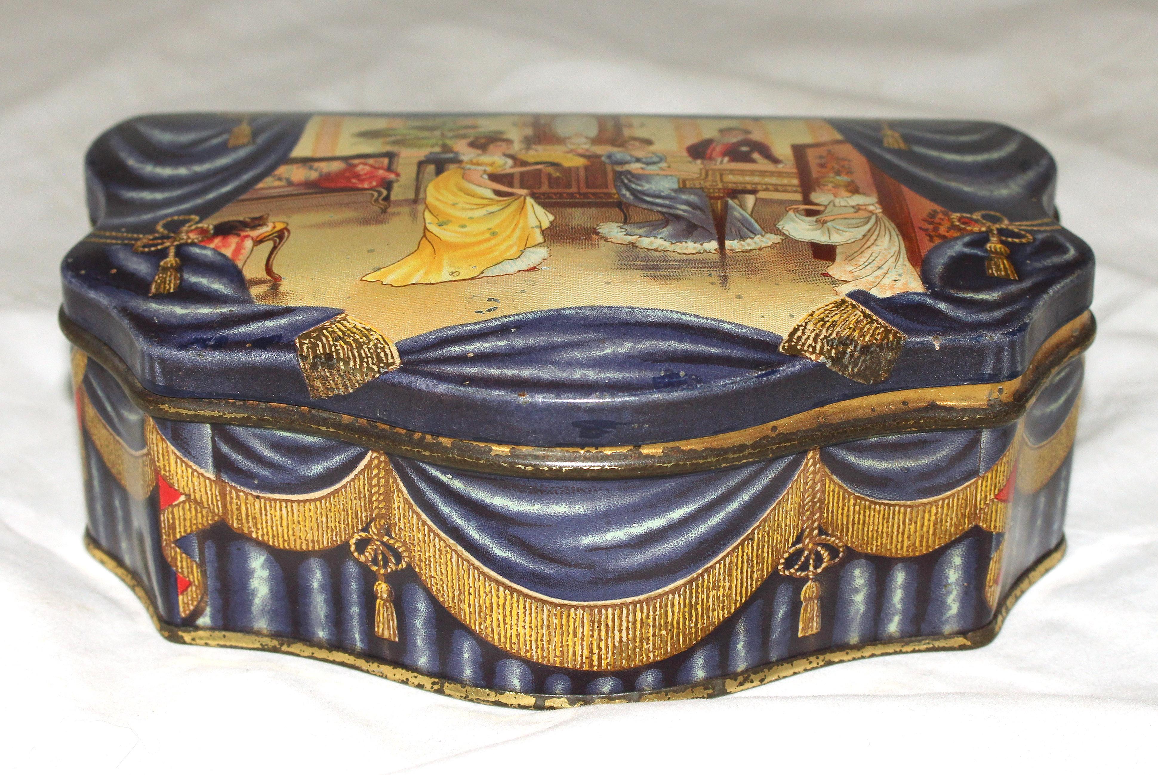 The Music Room, an elegant Victorian cartouche form. Huntley & Palmers biscuit tin.
6 1/2