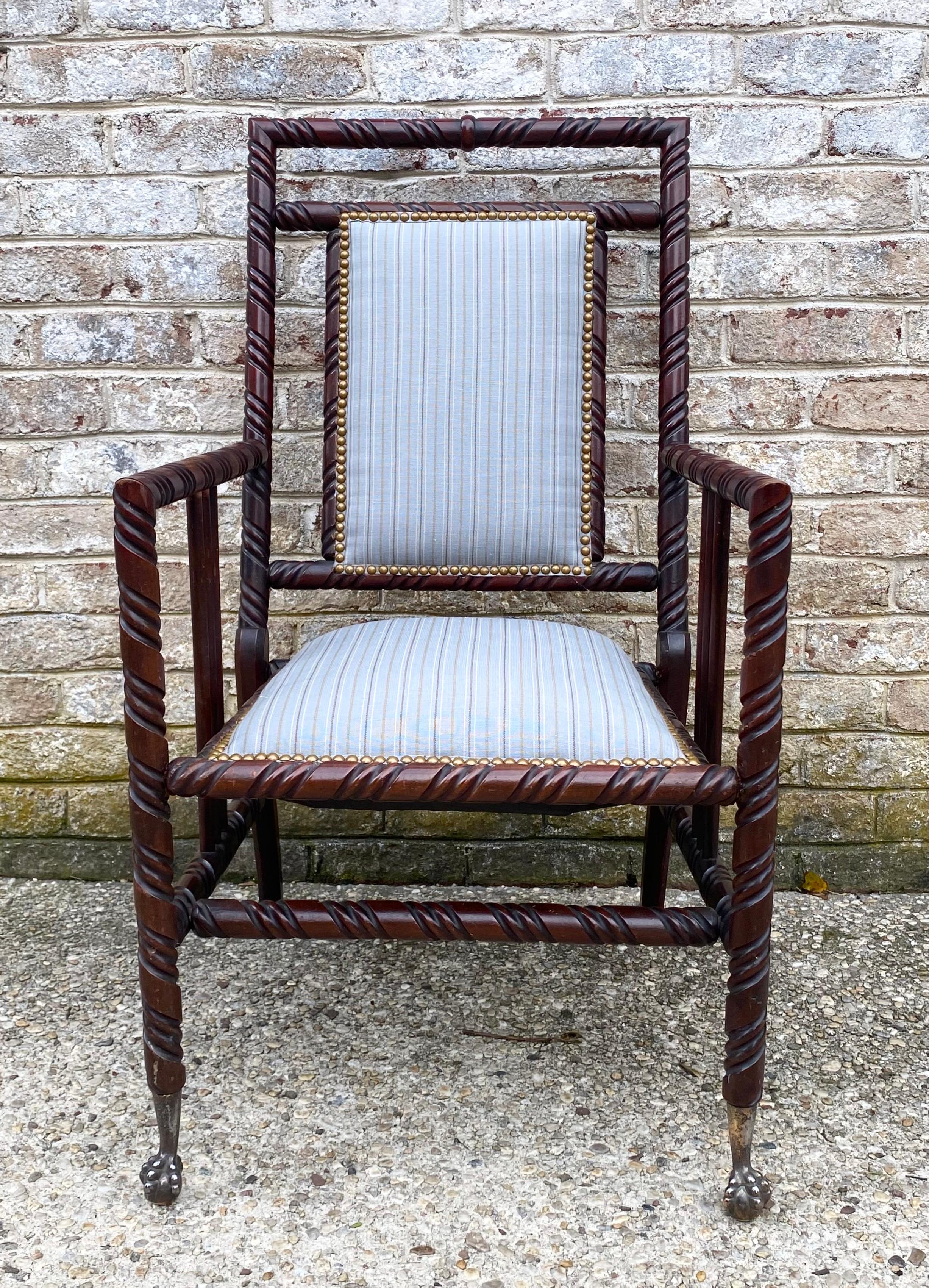 Victorian Hunzinger arm chair with new upholstery and nail heads..... front feet detail is exquisite.