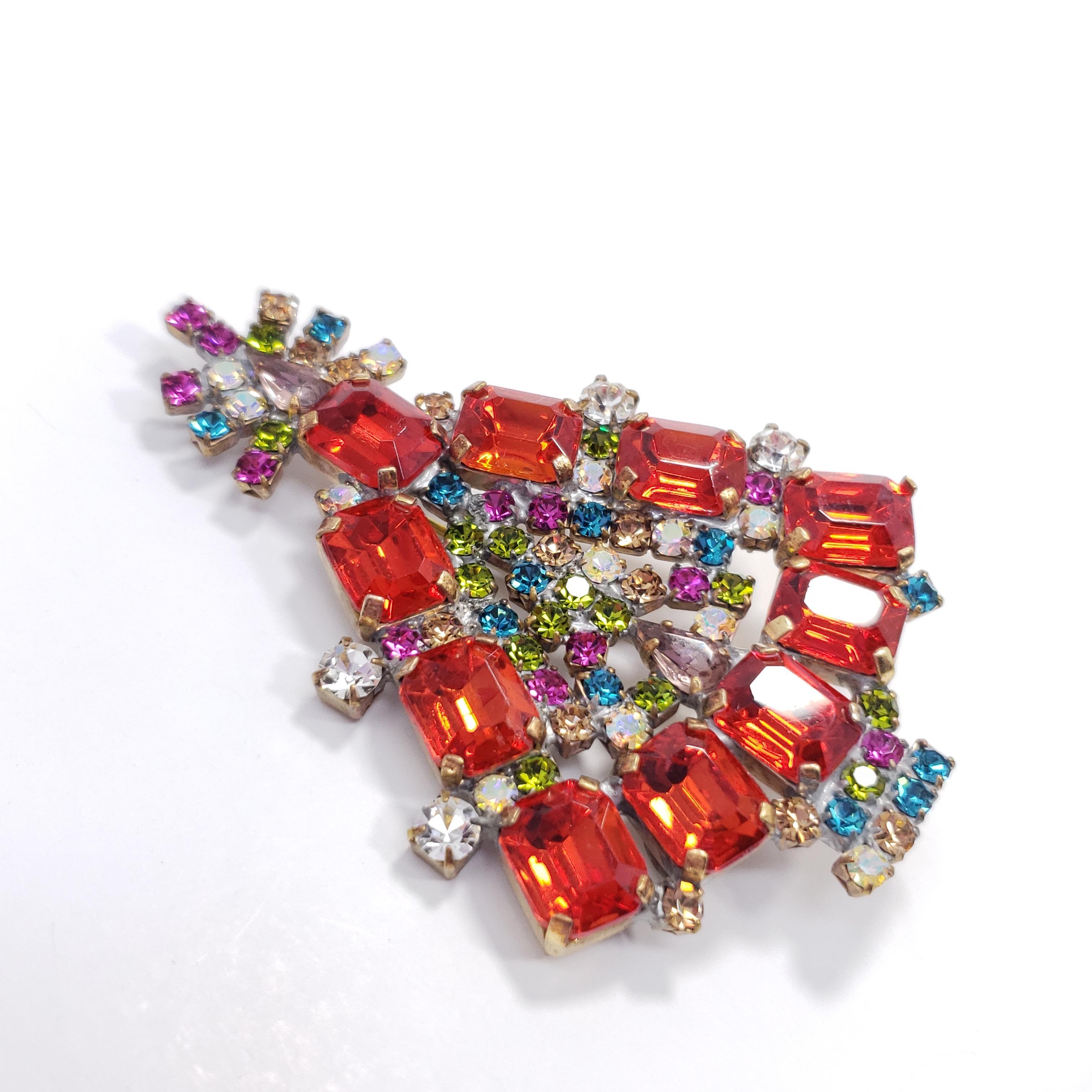 This delightfully festive pin features a Christmas tree decorated with dazzling crystals in ruby, sapphire, peridot, and topaz colors!

Marks / hallmarks / etc: Husar D