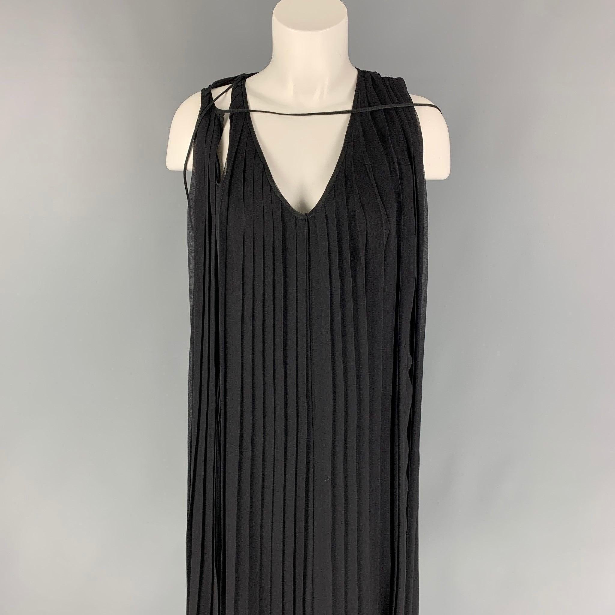 HUSSEIN CHALAYAN dress comes in a black pleated silk featuring an a-line style, sleeveless, and a v-neck. String detail attached could be styled in other ways.
Very Good
Pre-Owned Condition. 

Marked:   M 

Measurements: 
 
Shoulder: 13 inches 