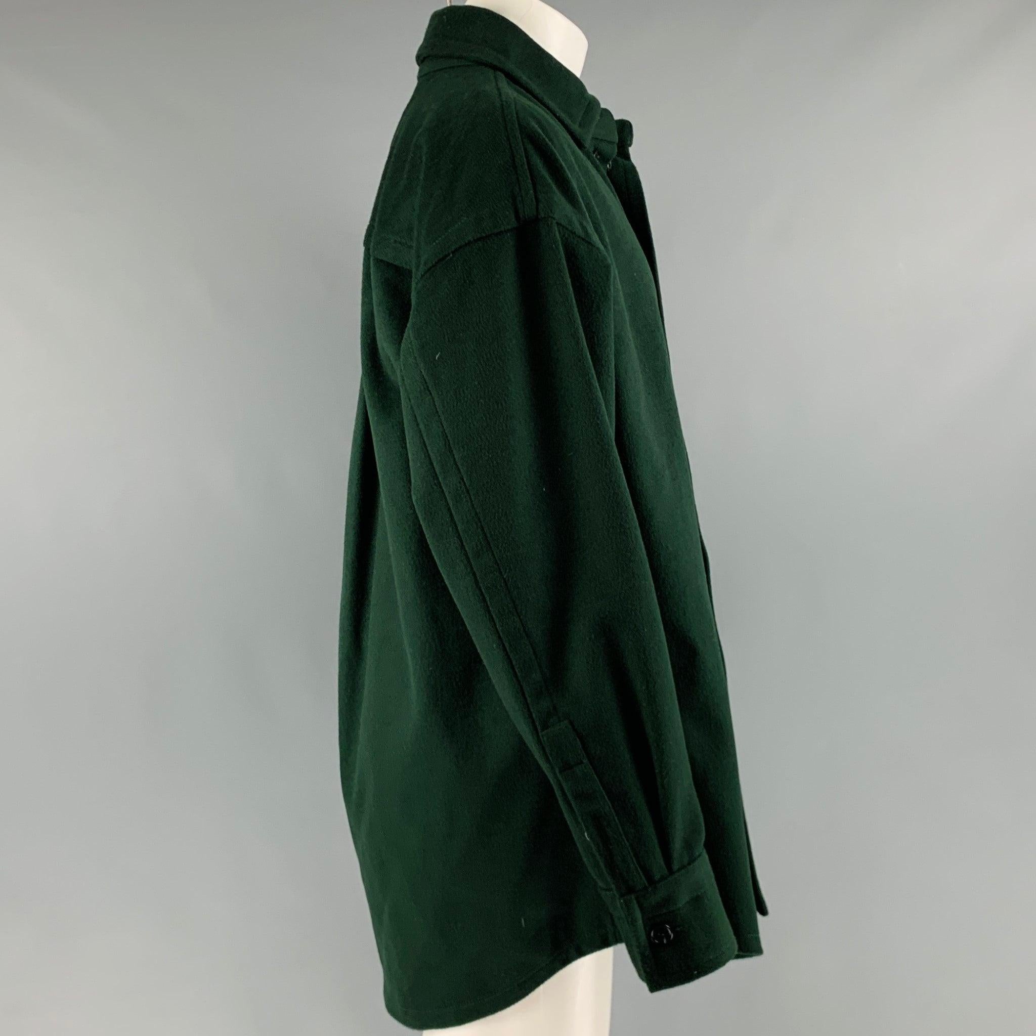 HUSSEIN CHALAYAN long sleeve shirt
in a forest green wool blend fabric featuring one patch pocket, spread collar, and button closure. Made in Italy.Excellent Pre-Owned Condition. 

Marked:   48 

Measurements: 
 
Shoulder: 24 inches Chest: 50 inches