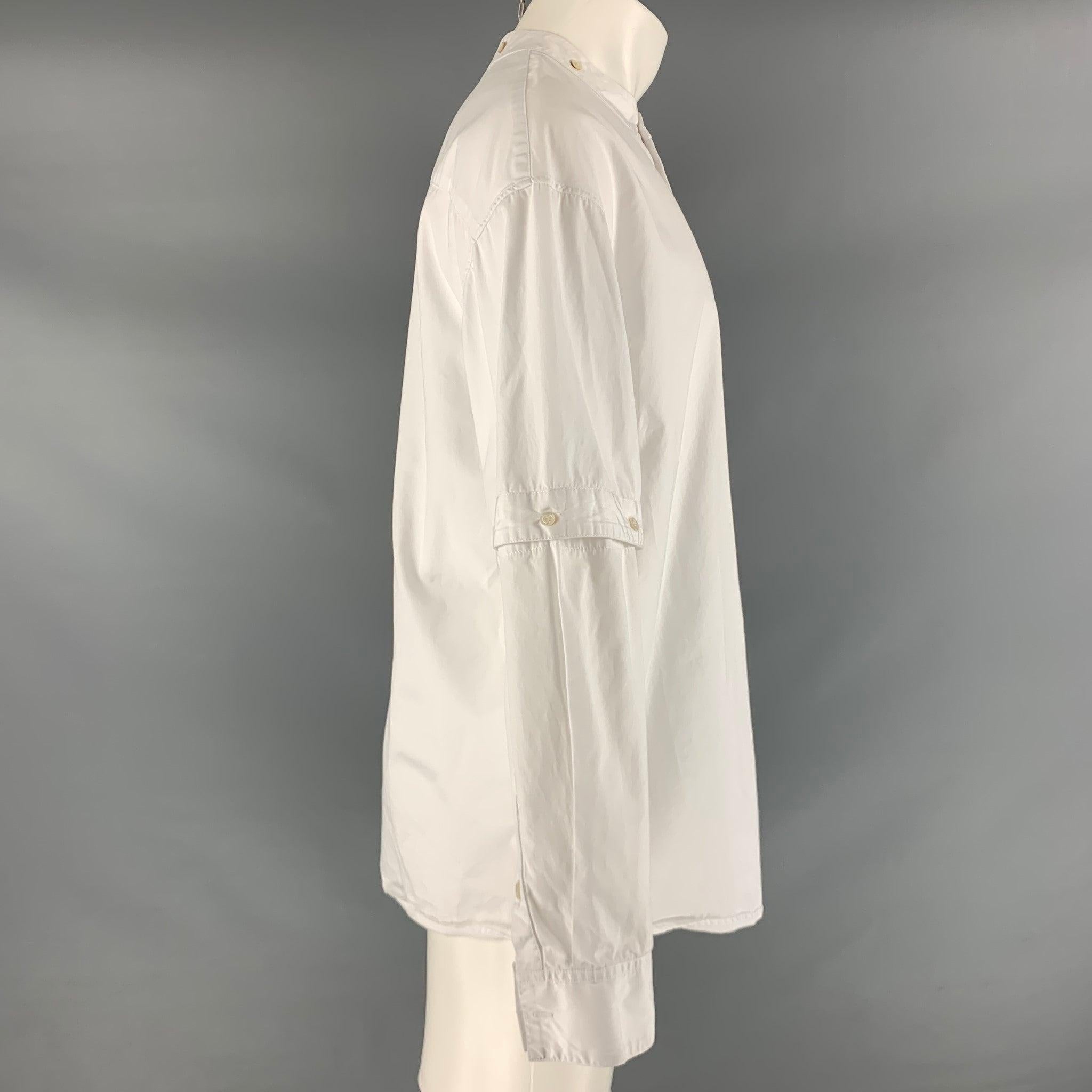 HUSSEIN CHALAYAN long sleeve oversized shirt comes in a white cotton featuring a button up style, nehru color, and adjustable sleeves.Excellent Pre-Owned Condition. 

Marked:   48
 

Measurements: 
 
Shoulder: 23 inches Chest: 46 inches Sleeve: 22.5