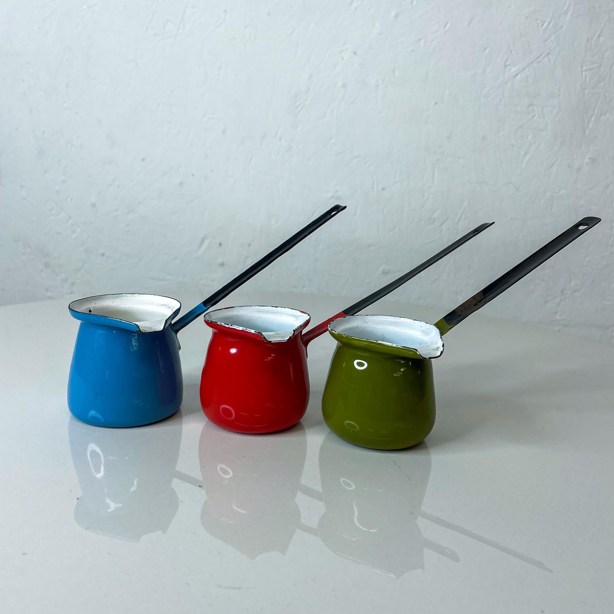 Ideal for farm house kitchen rustic cabin cottage life
Espresso Turkish coffee or ladle long handle feature
 Huta Silesia primary color enamel espresso shot Turkish coffee cups made in Poland 1960s
Measures: 6.25 Length x 2.5 diameter x 4 height