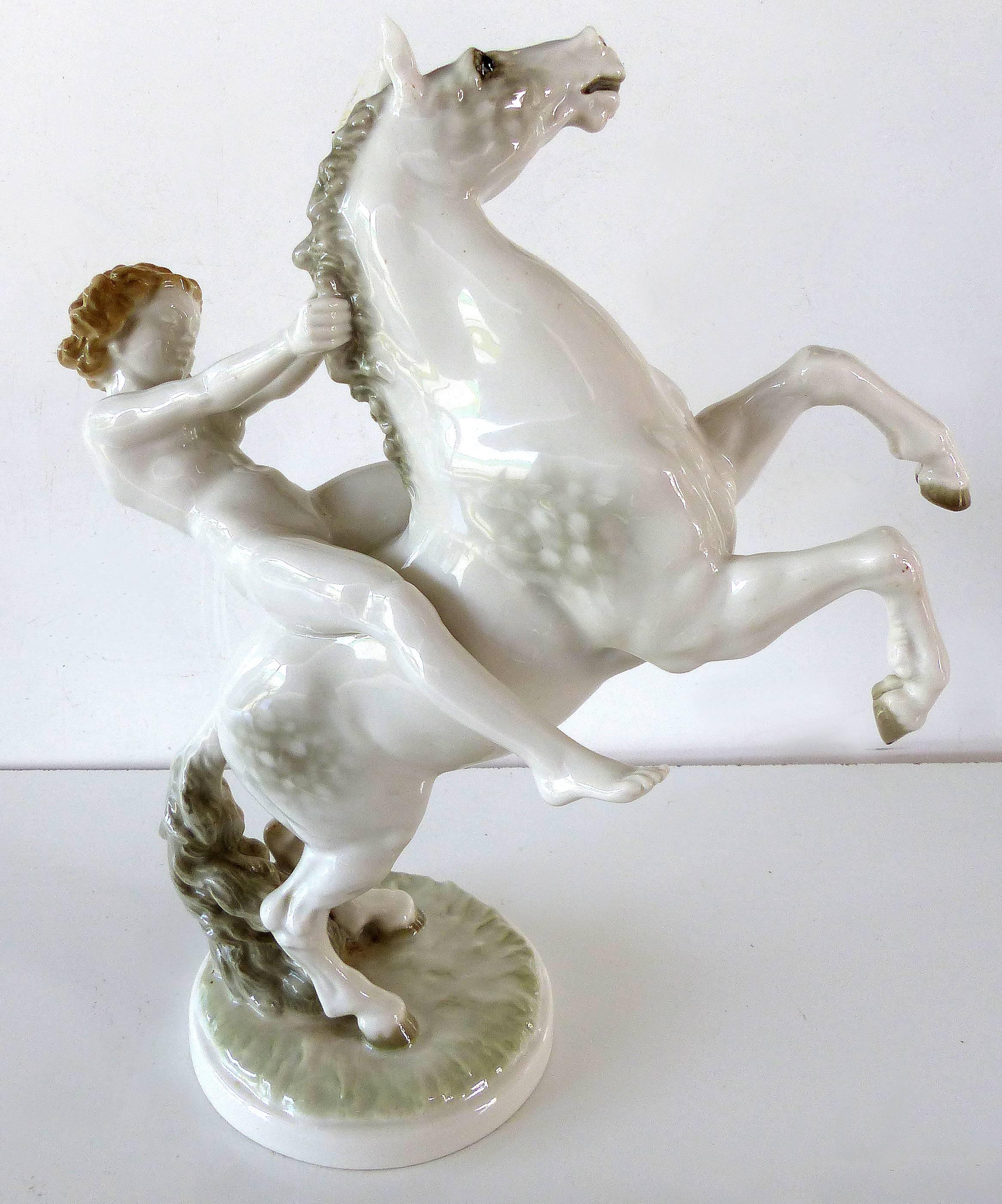 Hutschenreuther Germany Porcelain Rearing Horse and Rider

Offered for sale is a circa 1940s Hutschenreuther Germany porcelain statuette of a nude on a rearing horse by K. Tutter. The base retains the original paper sticker which reads 8813/2F.