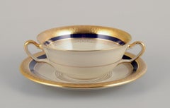 Hutschenreuther, Germany. Seven bouillon cups and saucers in porcelain.
