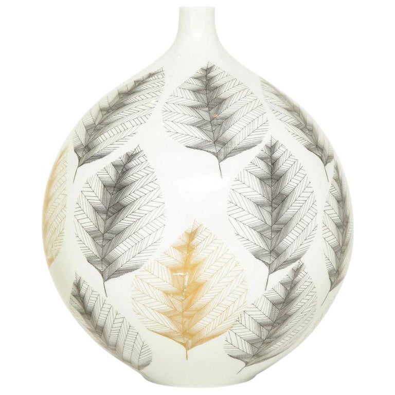 Hutschenreuther vase, porcelain, white, black, gold, leaf pattern, signed. Chunky medium scale bulbous form vase decorated with intricate black and gold leaves over a white glazed body. Signed on underside of the vase: Hutschenreuther Selb L.H.S.