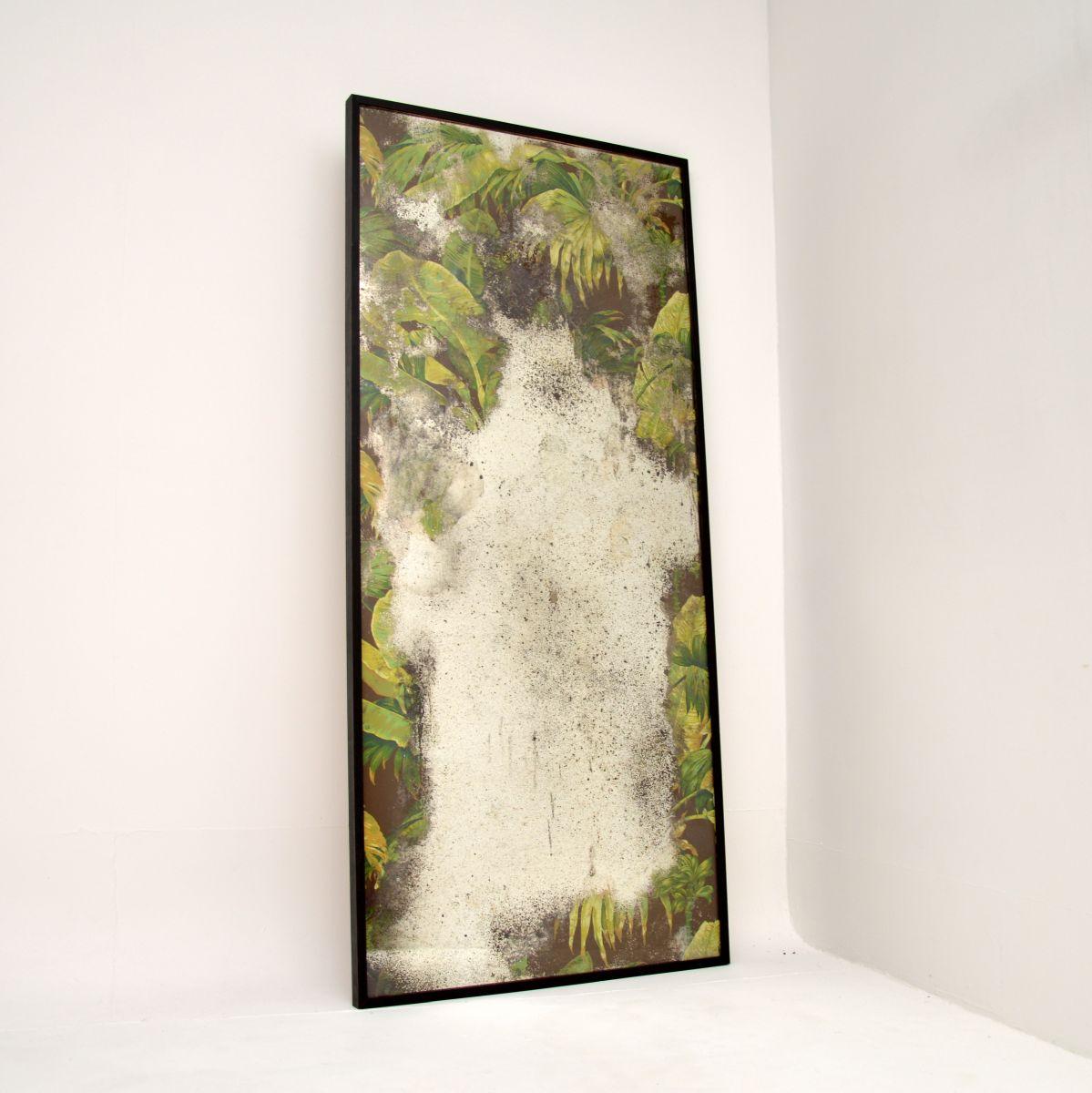 Originally commissioned by a renowned interior designer, this is one of a pair of ‘Textile mirrors’ by artist Huw Griffith. Botanical flowers by Pierre Frey of Paris (Percy Bass/ brown colourway) are laid beneath hand silvered mirror and bespoke