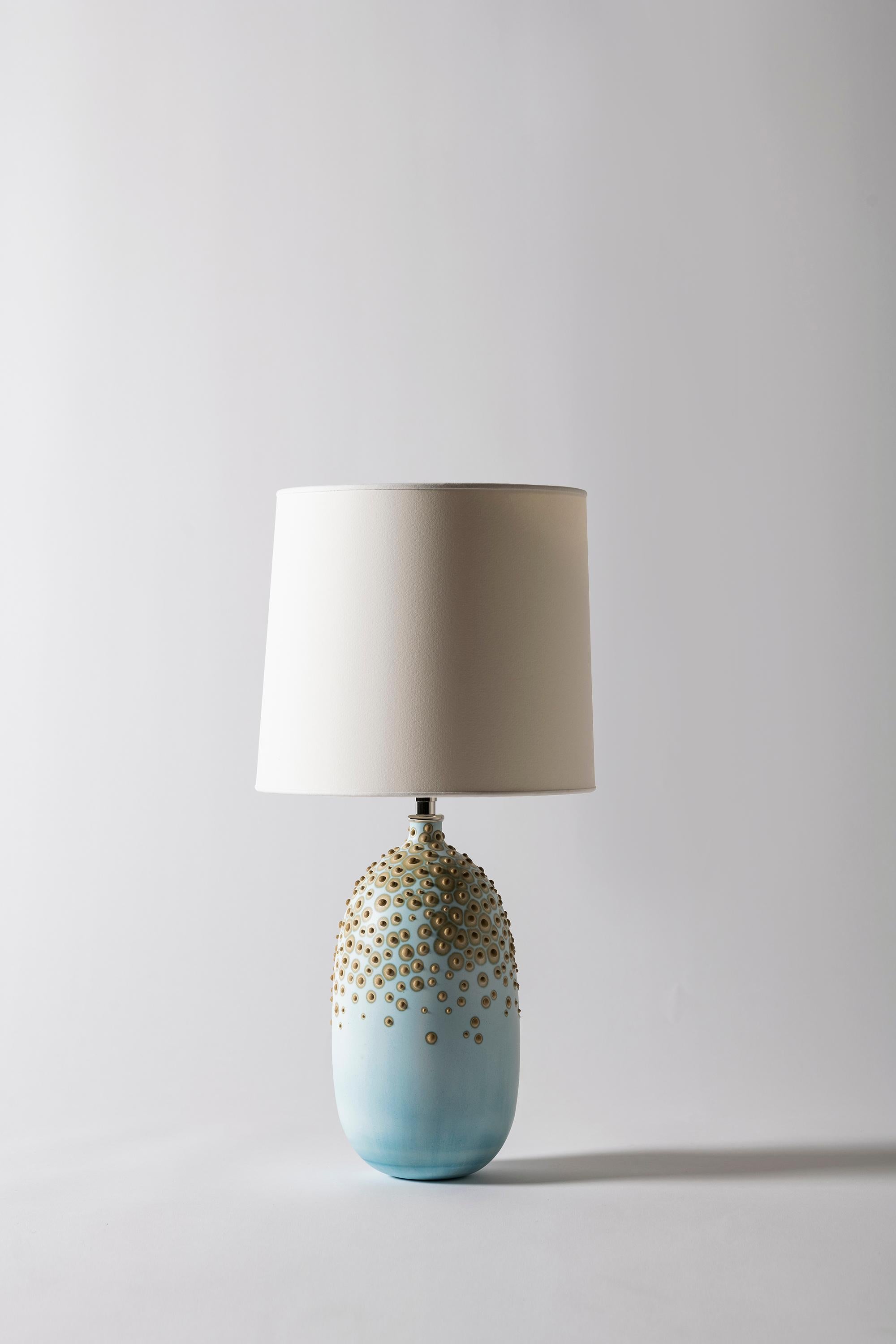Huxley lamp in Glacier by Elyse Graham
Dimensions: D26 x H51 cm
Materials: Plaster, Resin, Cotton rag Paper, brass, Nickel.Hardware: polished nickel-plated brass UNO threaded socket
with turn key switch, in-line dimmer.
Molded, dyed, and