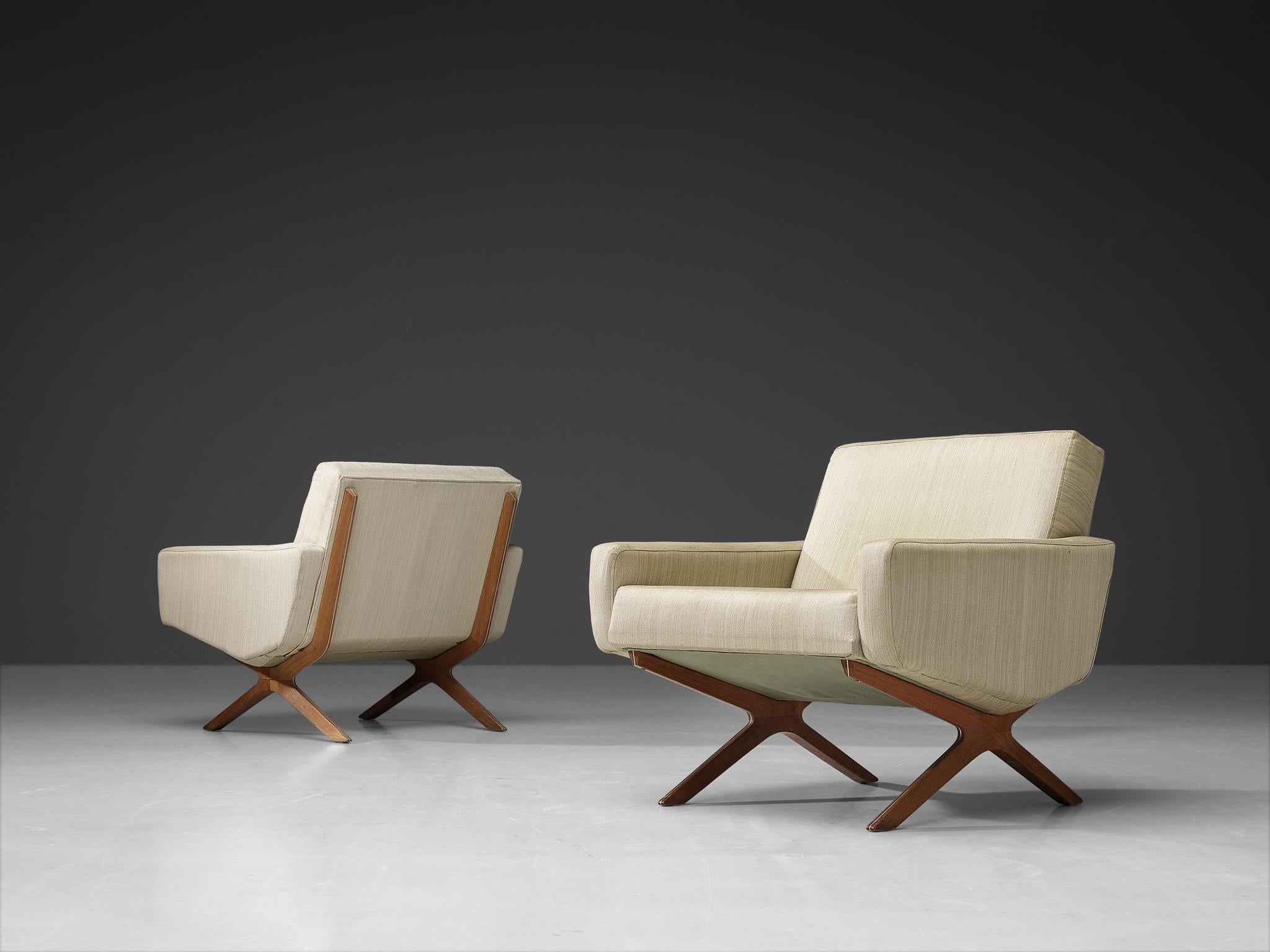 Peter Hvidt & Orla Mølgaard Nielsen for France & Søn, lounge chairs, model ´Silverline´, teak, off-white fabric and metal, 1960s.

Comfortable lounge chairs with an architectural design by Danish designers Hvidt & Mølgaard Nielsen. This model is