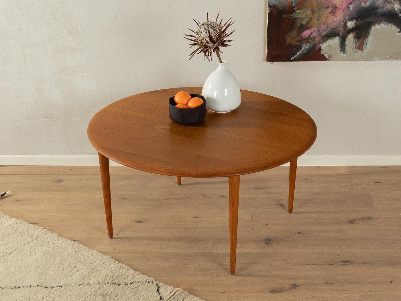 Classic coffee table by Peter Hvidt & Orla Mølgaard-Nielsen for France & Son from the 1960s. High-quality solid frame and table top made of teak.

Quality Features:
    accomplished design: perfect proportions and visible attention to detail
   