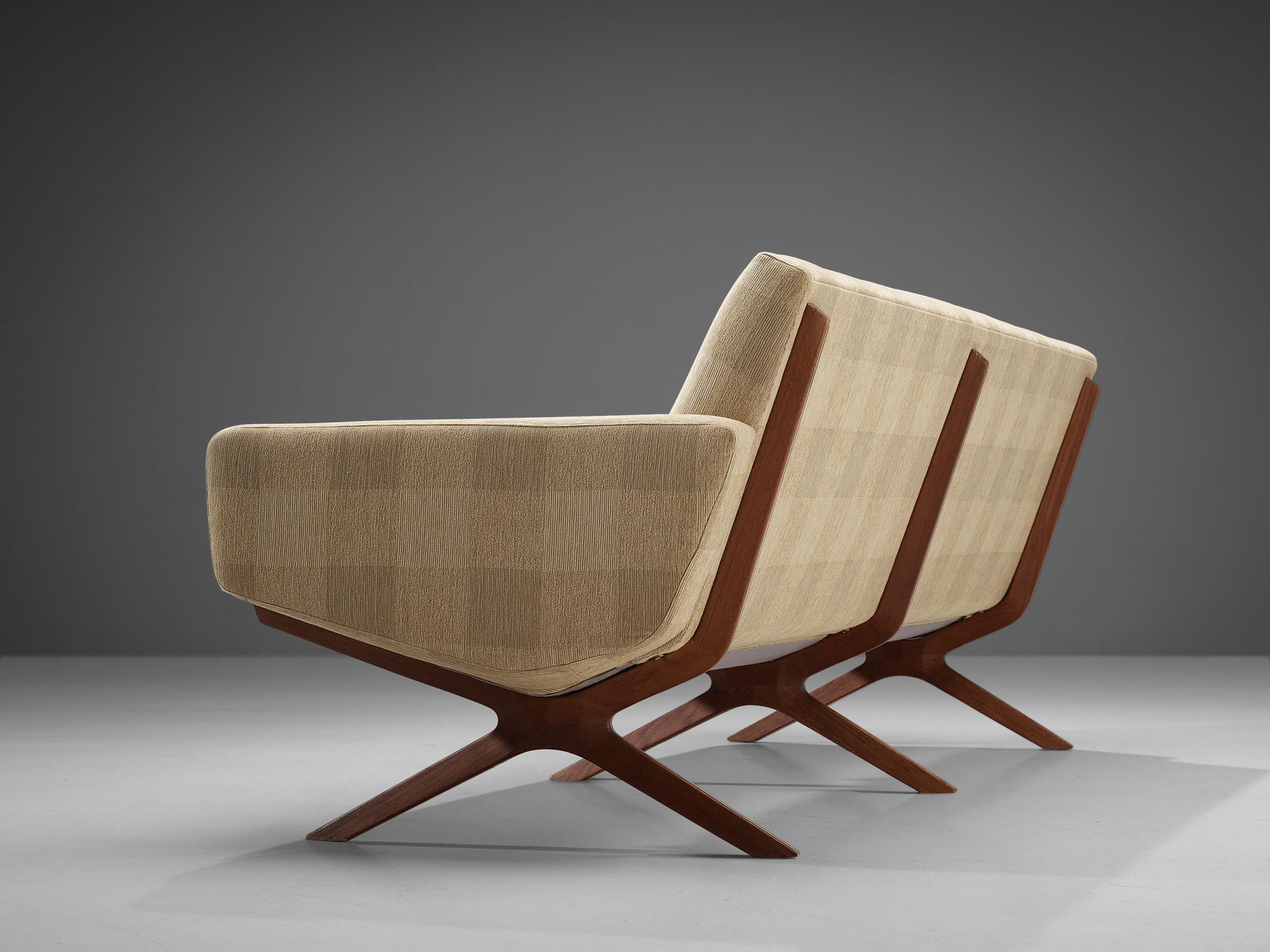 Peter Hvidt & Orla Mølgaard Nielsen, three-seat sofa, model 'Silverline', fabric, teak and metal, 1950s.

Comfortable sofa with an architectural design by Hvidt & Mølgaard. This model is called silverline, due to its aesthetic metal line in the