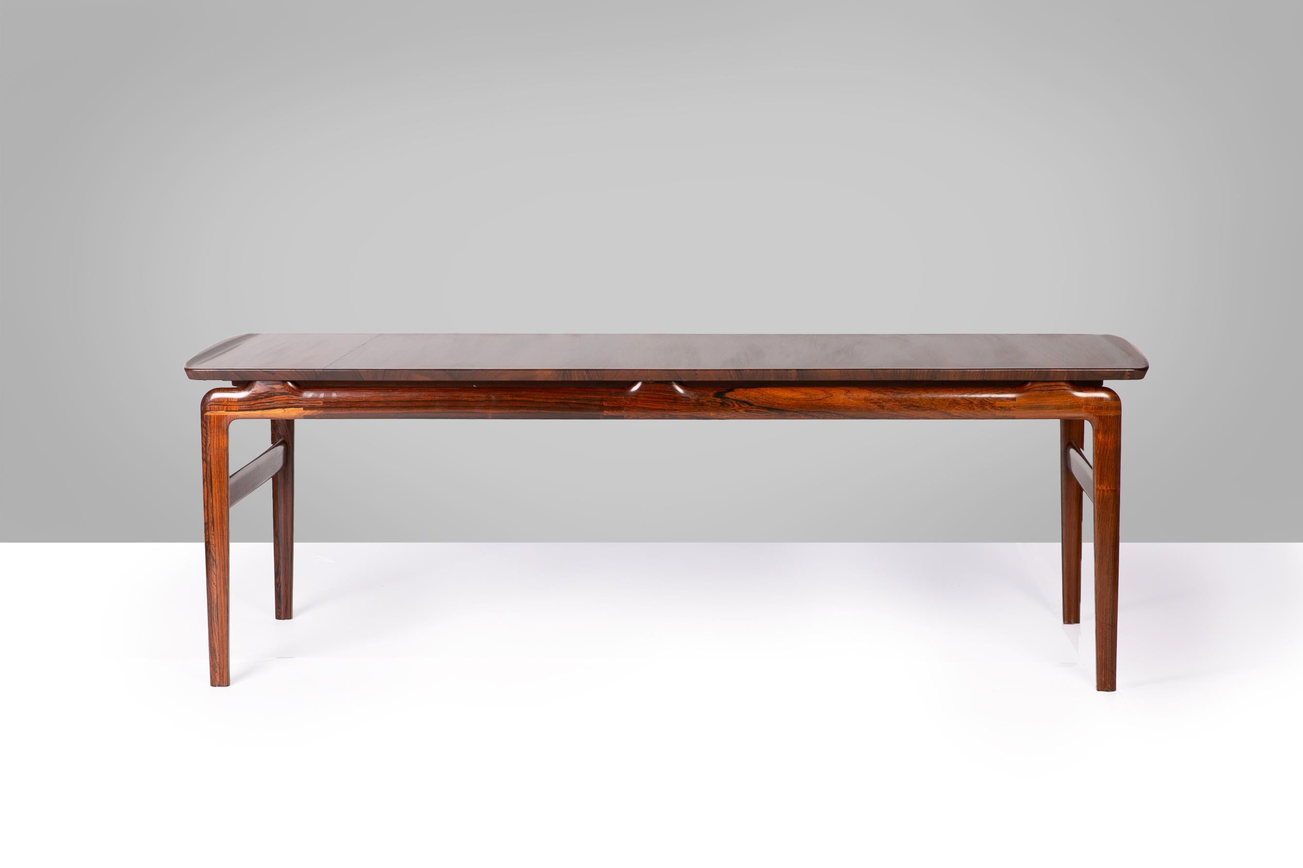 An exceptional example of Scandinavian modernism, this coffee table by Hvidt & Mølgaard embodies the duo’s refined approach to form and function. Executed in richly grained solid rosewood, the piece is distinguished by its masterful construction and