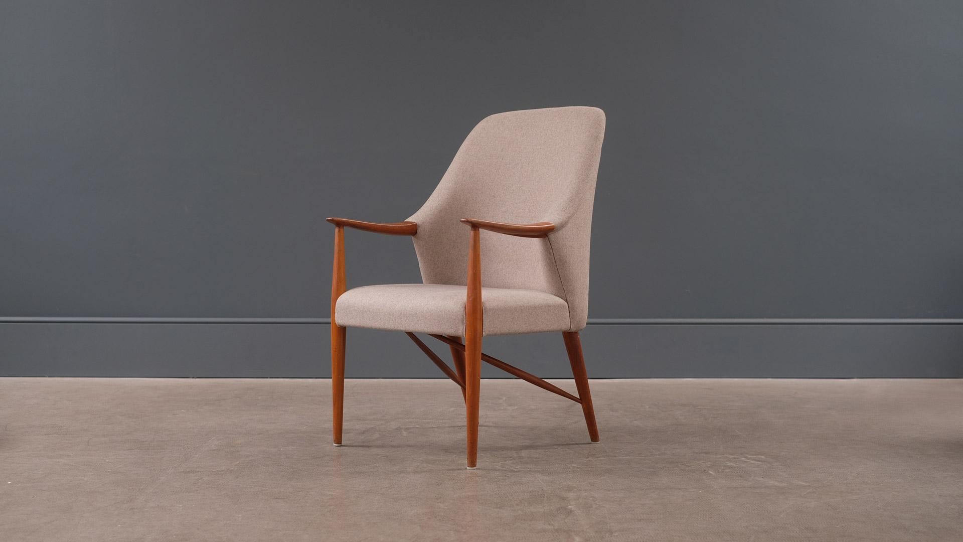 Rare and beautiful armchair designed by Danish Architects Hvidt & Molgaard for master cabinet maker A J Iversen. Solid sculptural teak frame fully refurbished and re-upholstered in greige wool fabric. Lovely chair.