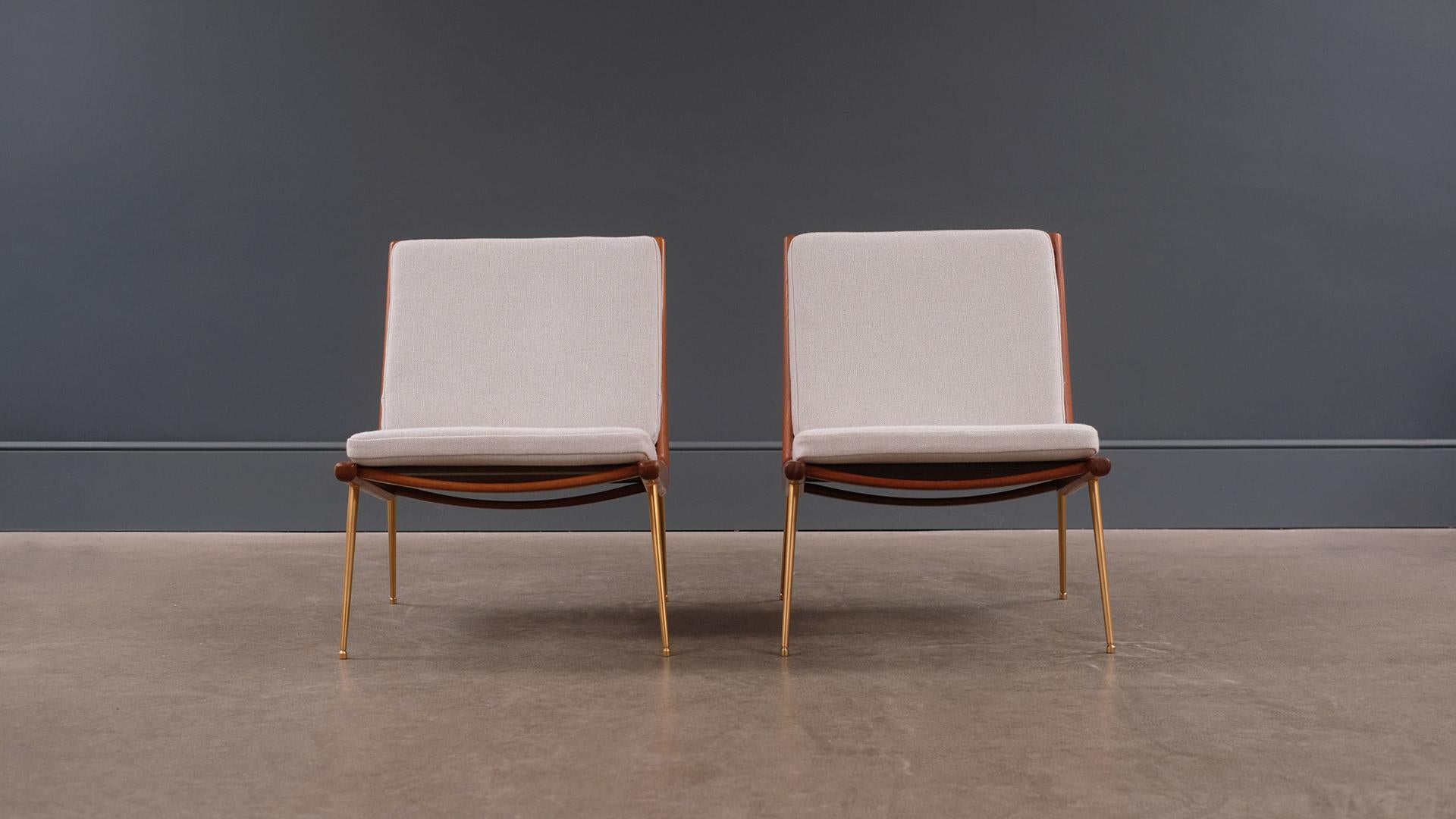 Wonderful pair of early Boomerang chairs designed by Peter Hvidt and Orla Mølgaard Nielsen for France and Daverkosen, Denmark, 1959. Sculptural solid teak frames with new cushions upholstered in Kvadrat Hallingdal 65.

  