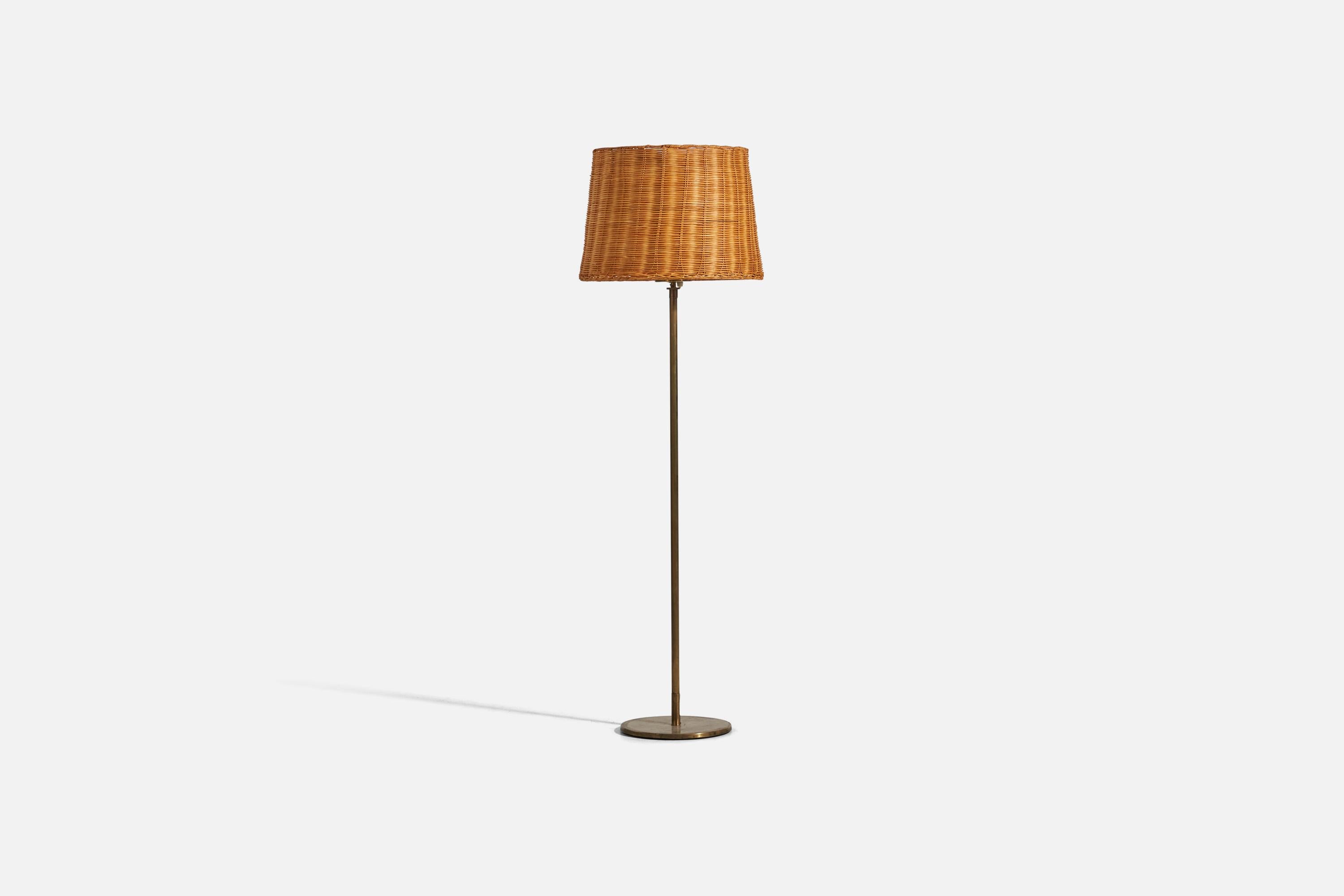 A brass and rattan floor lamp designed and produced by a H.W. Armatur, Sweden, 1950s. 

Dimensions variable, measured as illustrated in first image.

Sold with Lampshade. Dimensions stated are of floor lamp with Lampshade.

Socket takes
