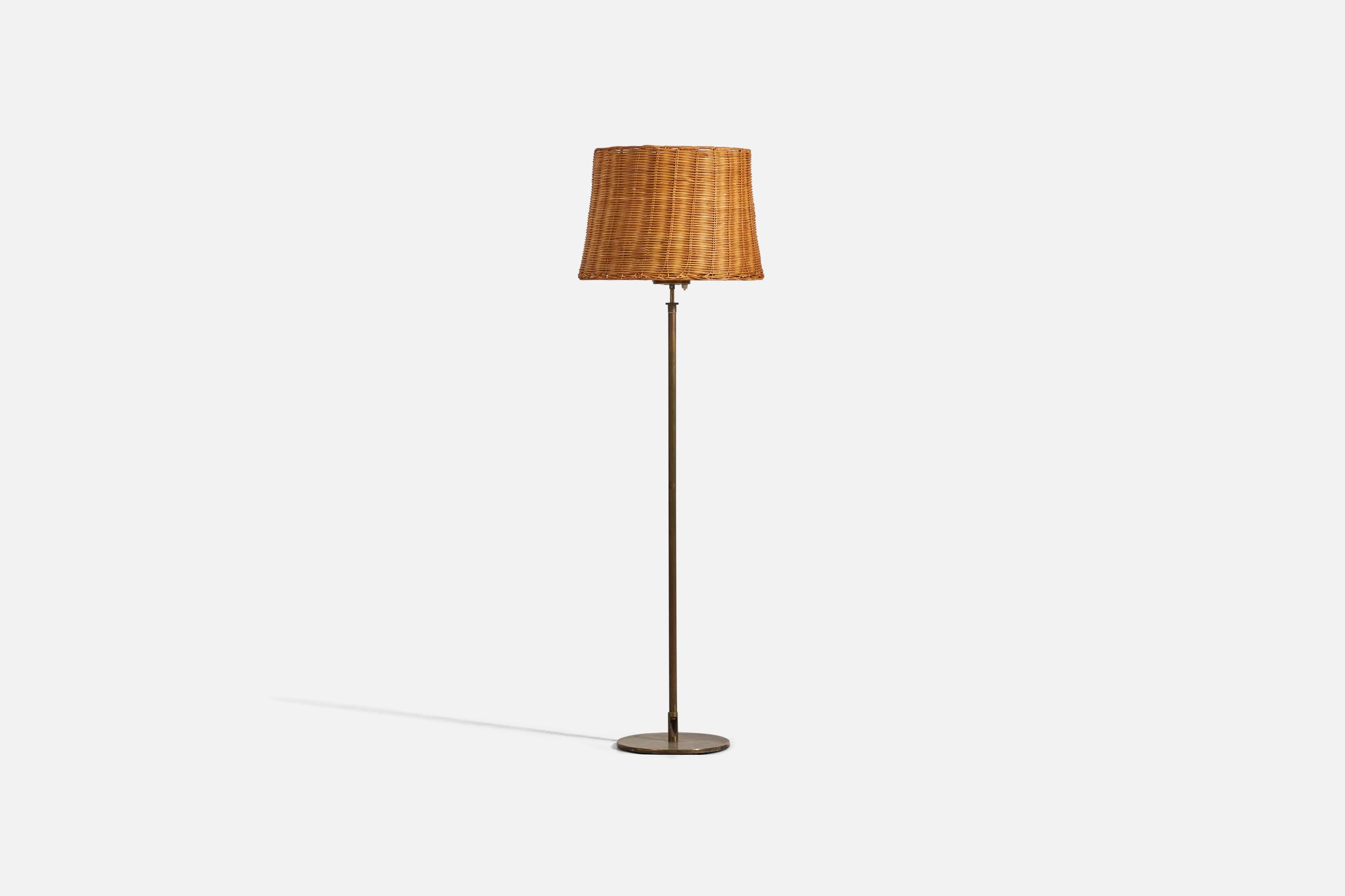 A brass and rattan floor lamp designed and produced by a H.W. Armatur, Sweden, 1950s. 

Dimensions variable, measured as illustrated in first image.

Sold with Lampshade. Dimensions stated are of Floor Lamp with Lampshade.

Socket takes