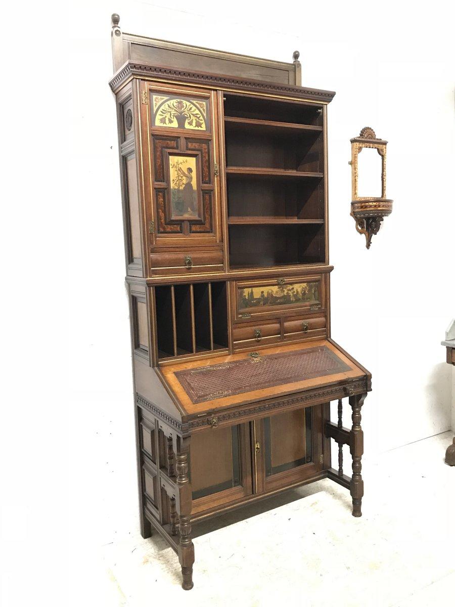 Henry William Batley. Illustrated in his book 'Series of Studies for Domestic Furniture Decoration'.
Made by Gillows & Co.
An important Aesthetic Movement secretaire bookcase in walnut, parcel gilt and thuya wood.
Stamped 'Gillows 13165'
Last