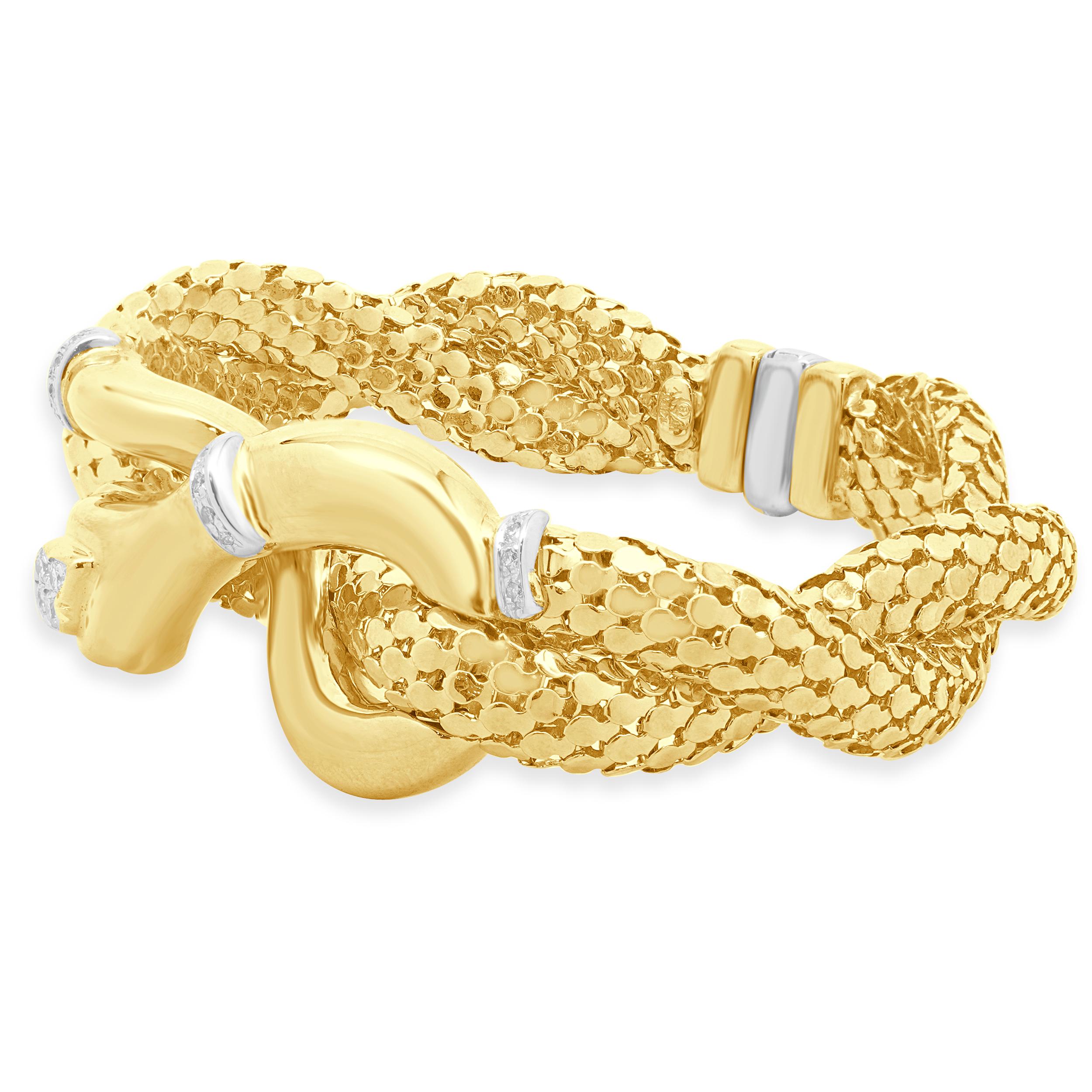Designer: H.W. Burdick
Material: 14K yellow gold
Diamonds: 15 round cut = 0.39cttw
Color: H
Clarity: SI1
Dimensions: bracelet would fit approximately a 6.5-inch wrist
Weight: 46.8 grams
