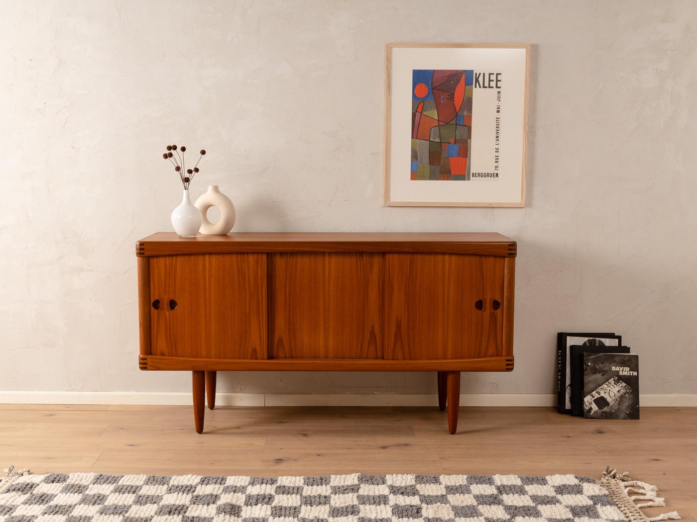 Rare sideboard from the 1960s by H.W. Klein for Bramin. High quality corpus in teak veneer with two sliding doors, two shelves and solid wood feet.

Quality Features:
    accomplished design: perfect proportions and visible attention to detail
   