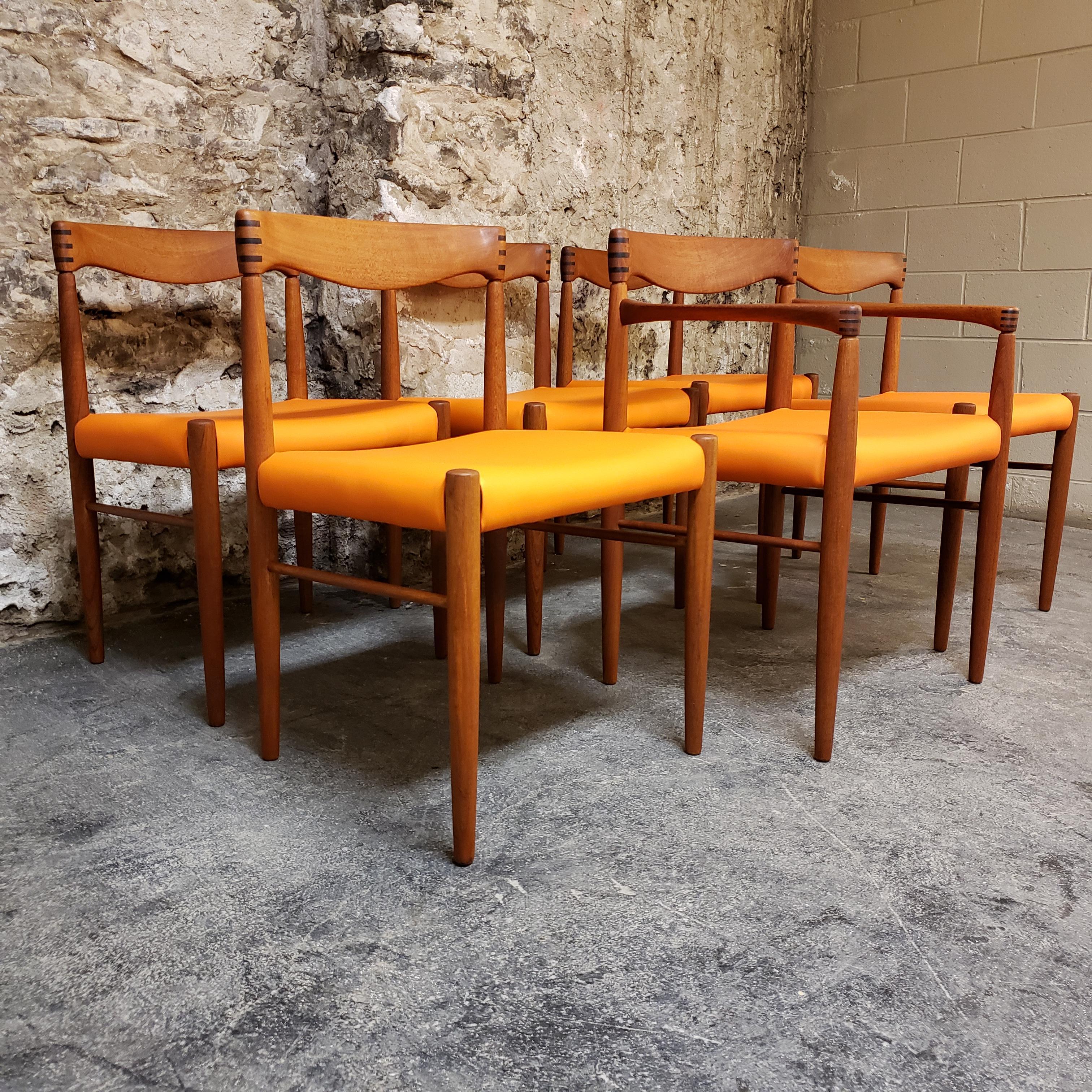 Set of 6 teak HW Klein for Bramin dining room chairs. They are beautifully sculpted and the backs feature ornate joining work. They have been reupholstered in a Maharam Alloy Navel vinyl. The set of 6 comes with one captains chair.

Scandinavian