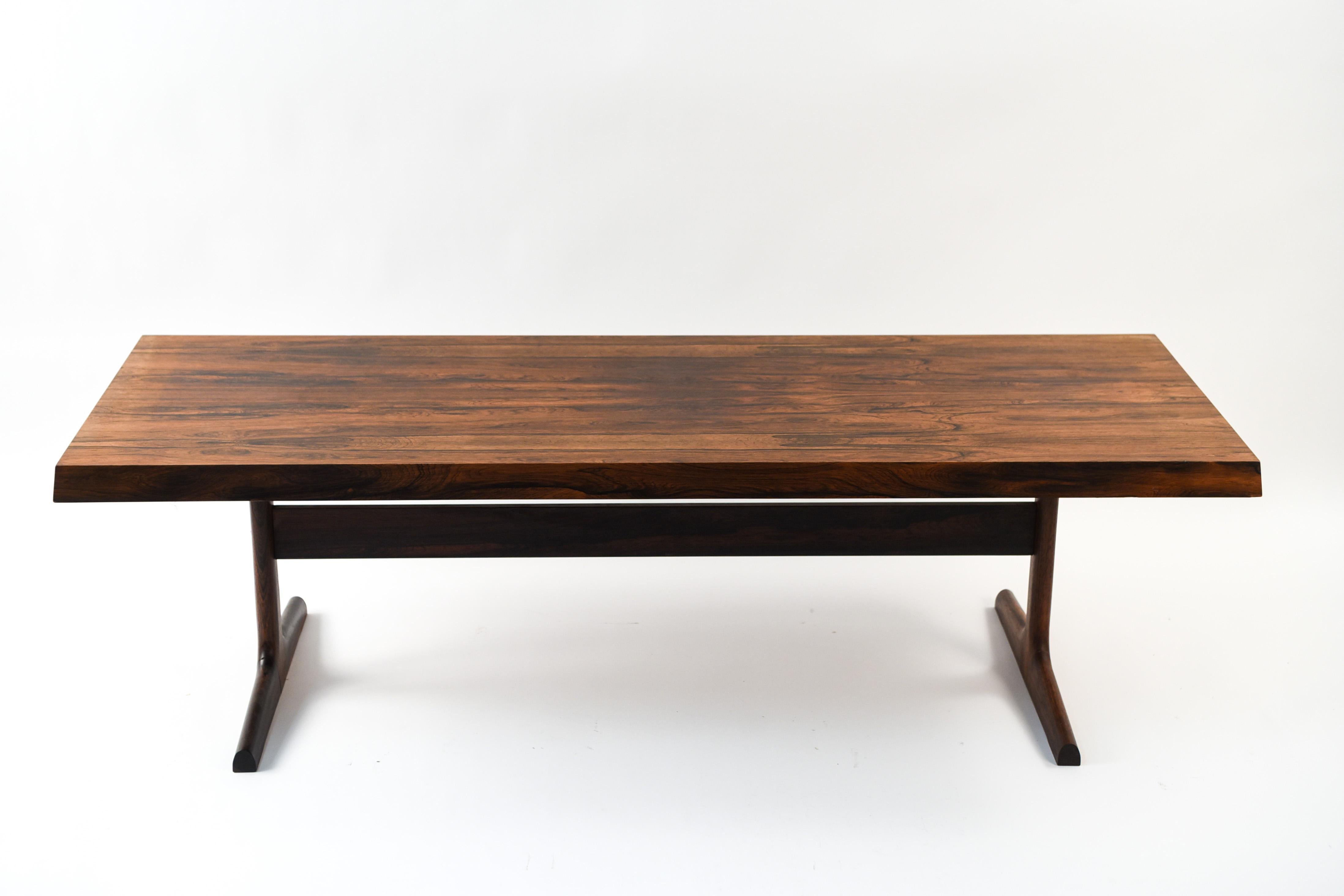 This Danish midcentury coffee table was designed by H.W. Klein, circa 1960s. Made of rosewood with a visually interesting grain pattern to the top. The simple rectangular form makes this a versatile piece that can be dressed up or down in an