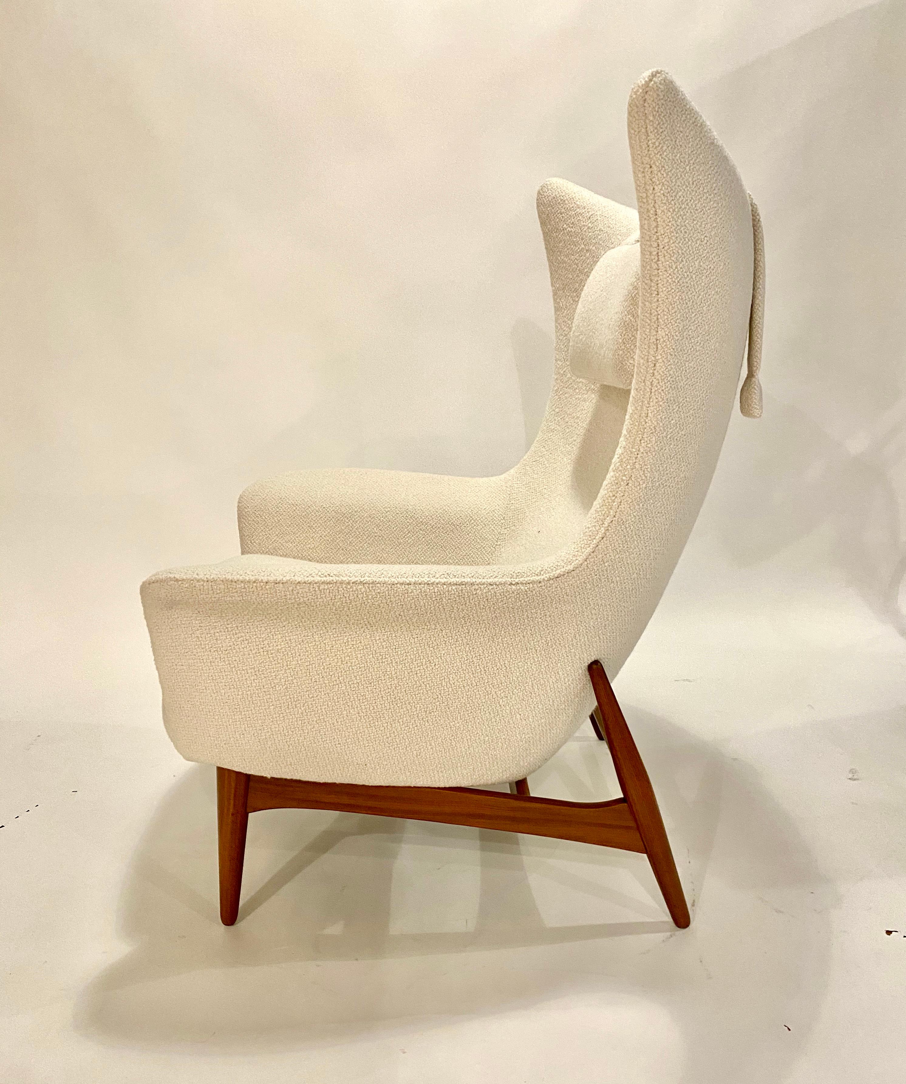 Model 207/5 midcentury Danish modern wingback lounge chair designed by Henry Walter Klein for NA Jorgensens Mobelfabrik aka Bramin Mobler, 1960s. Professionally restored and reupholstered in an Italian ivory bouclé.