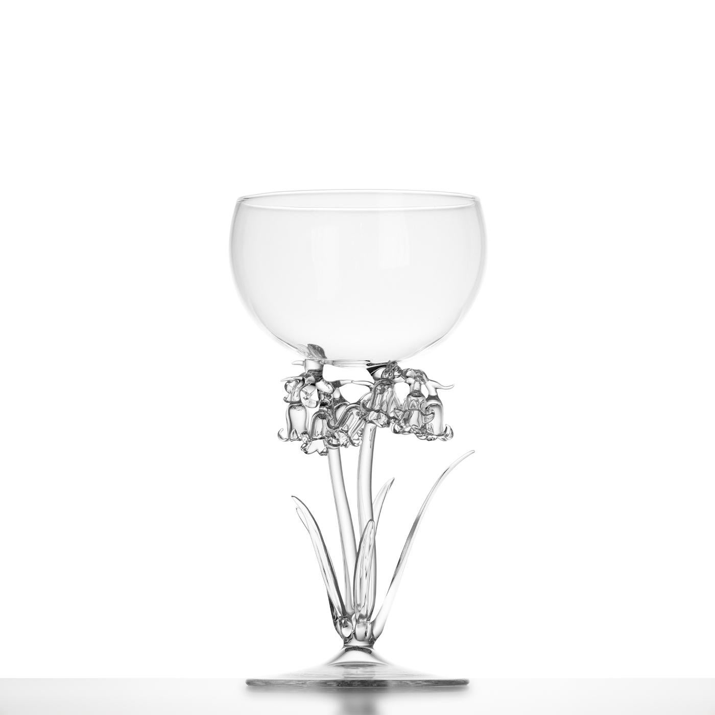 This glass belongs to a collection of 21 unique pieces, each inspired by a different botanical species and reimagined by Simone Crestani from archival Fratelli Toso drawings. Shaped in transparent glass through the flame of the lamp, it evokes a