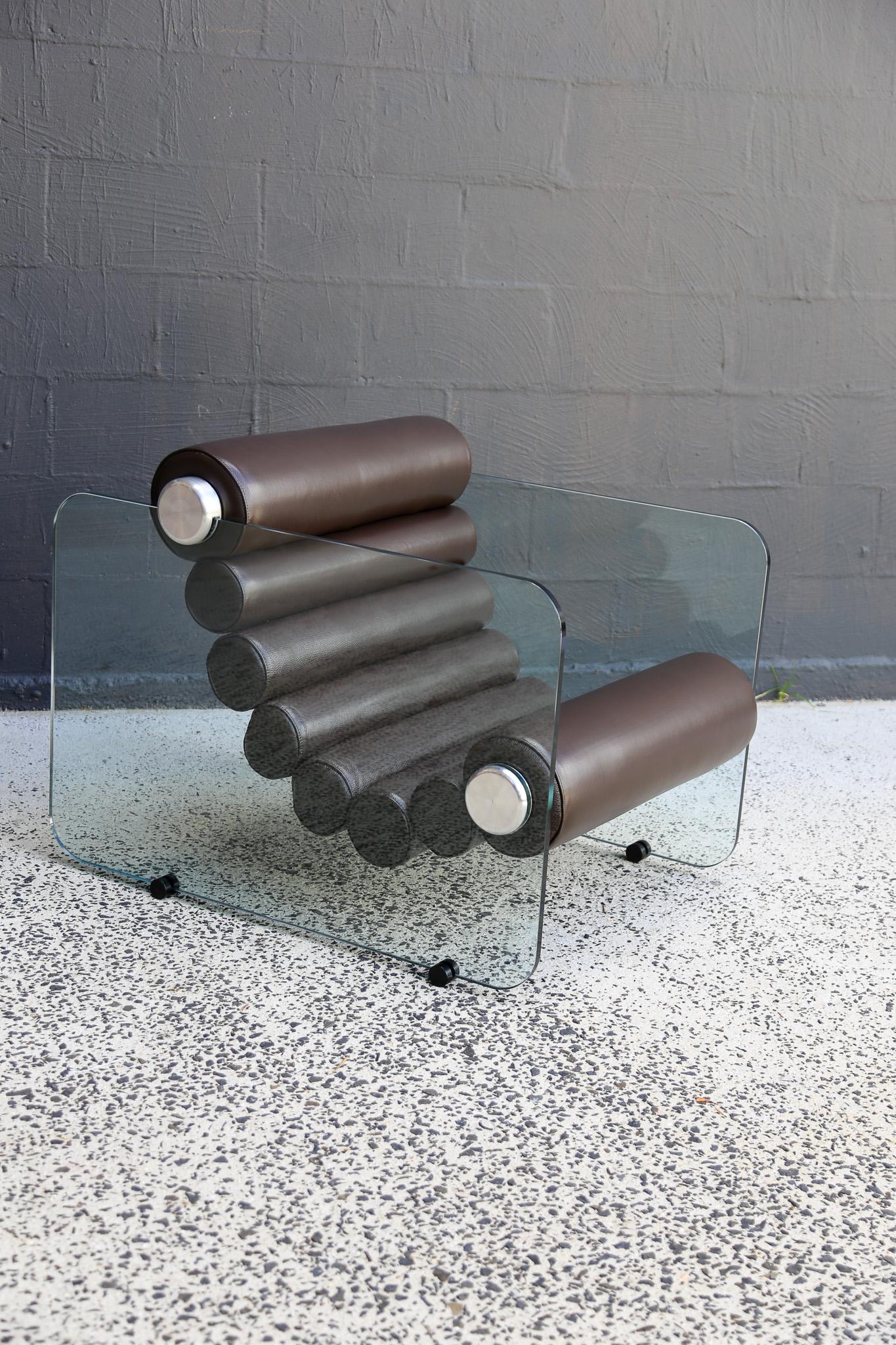 Set of two available
Italian space age design by Fabio Lenci, the Hyaline (pronounced as “Hay’Line) chairs are a prime example of Italian design of the time period. The thick leather rolls are interconnected in a flexible form and are fixed to the