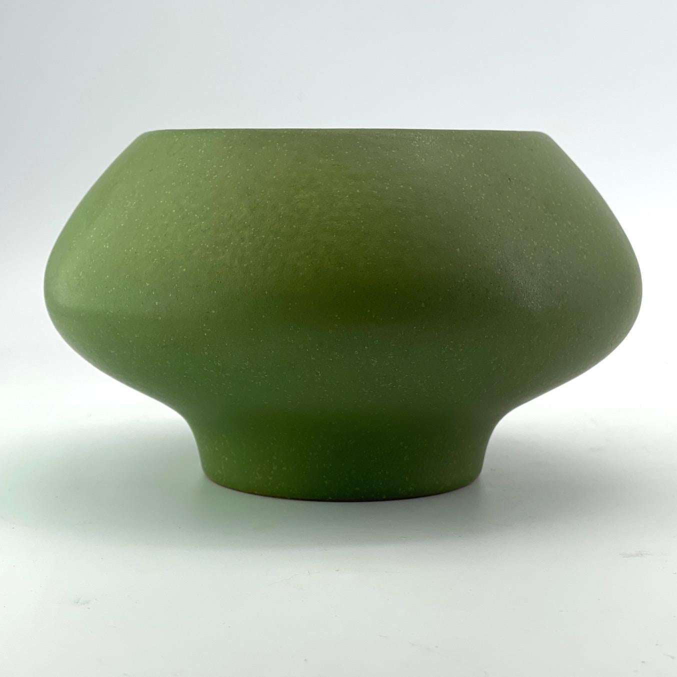 Rare item from Hyalyn by Herb Cohen.  Wonderful matte green with light speckles, on the perfect organic form. Impressed markings to bottom, USA 71.  Rings true no cracks.