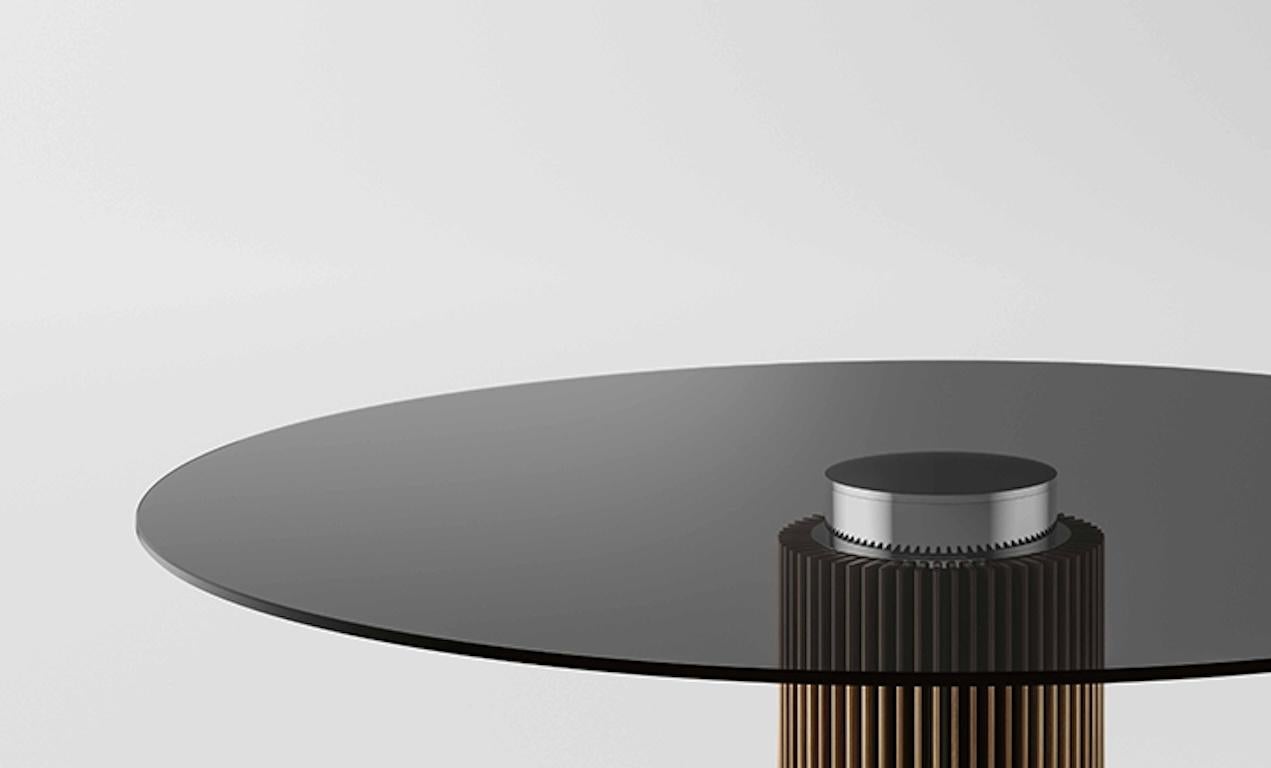 The rhythmic pace of the wooden strips composing the base of Hybrid make it a table of great contemporary charm. The alternation of materials between base and top express the design feature of the table and offers space to personalization allowing