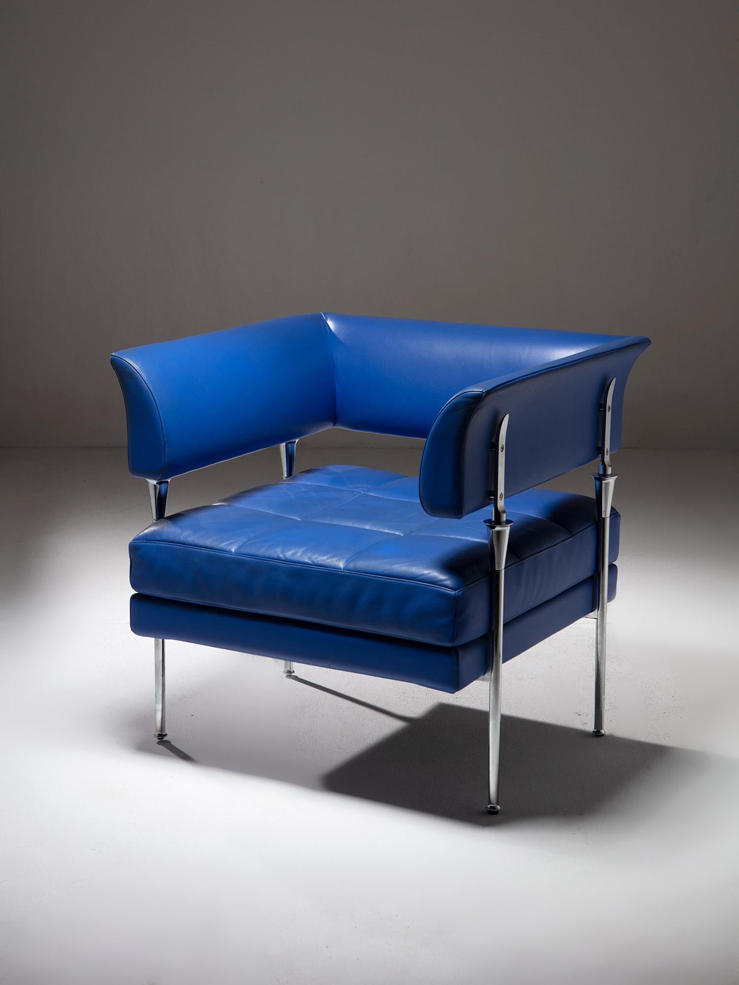 Sculptural chair by Luca Scacchetti for Poltrona Frau.
Blue leather covered seat and backrest, connected by a detailed chrome frame. Large and comfortable piece with visually suspended composing blocks. 