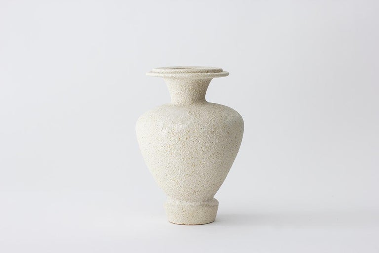 Hydria Hueso stoneware vase by Raquel Vidal and Pedro Paz
Dimensions: 24 x 16 cm
Materials: hand-sculpted, glazed pottery

The pieces are hand built white stoneware with grog, and brushed with experimental glazes mix and textured surface,